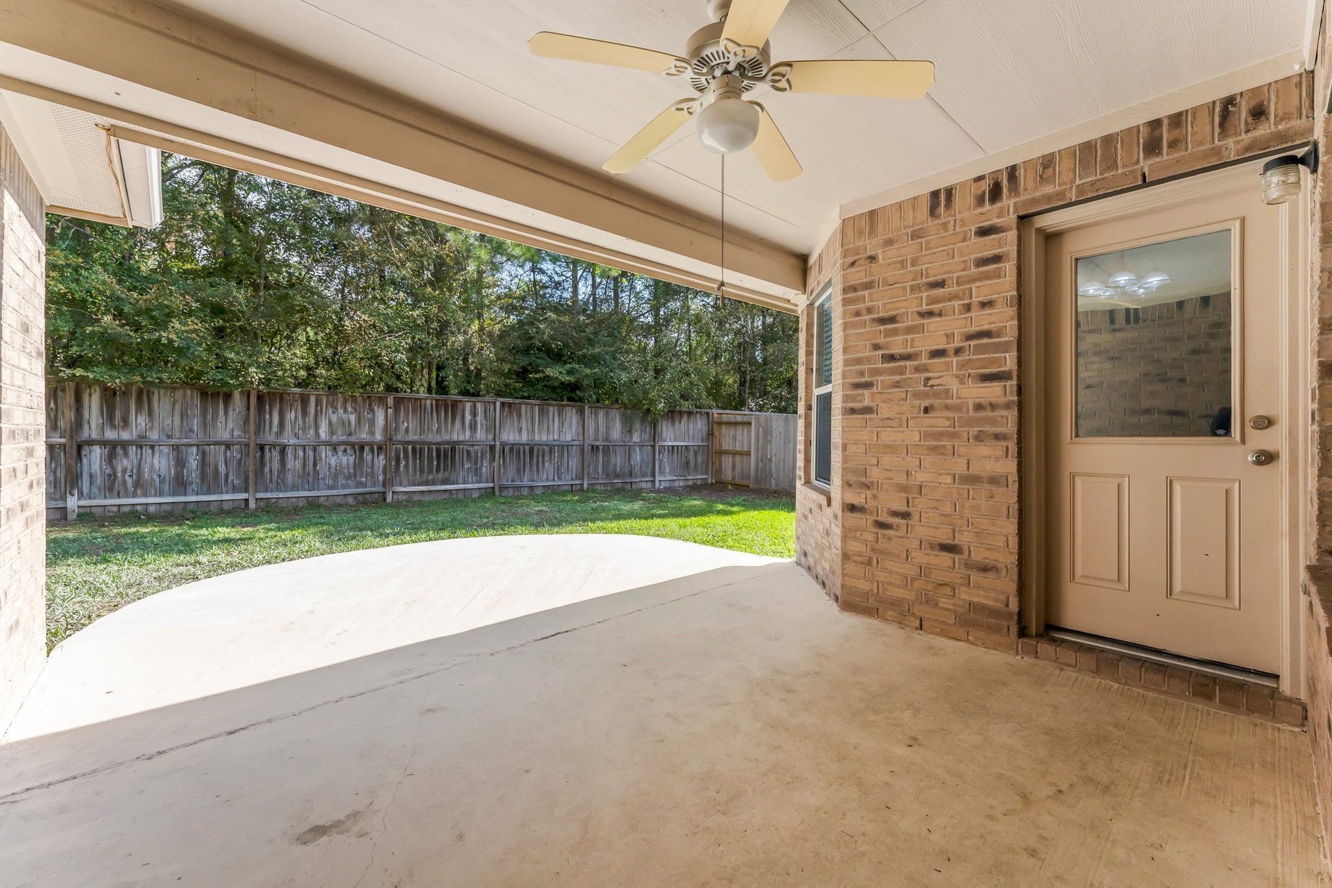 34 Bryce Branch Circle, The Woodlands, TX 77382 Covered patio with fan gives you cool sheltered views of the greenbelt. This is a very large 15X10 foot area.