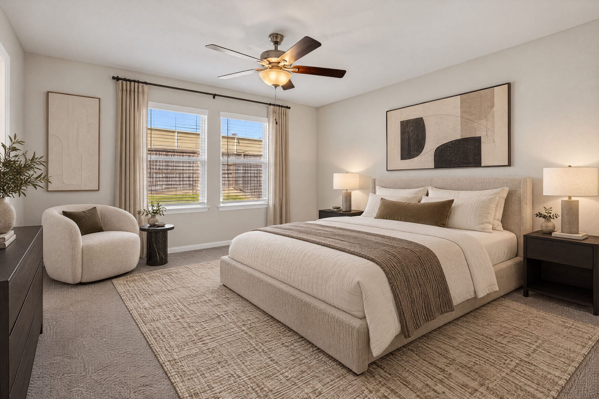 5243 Shallowhurst Lane, Katy, TX 77449 PRIMARY BEDROOM - The primary bedroom has plush carpet, a ceiling fan, and two large windows overlooking the fenced backyard.