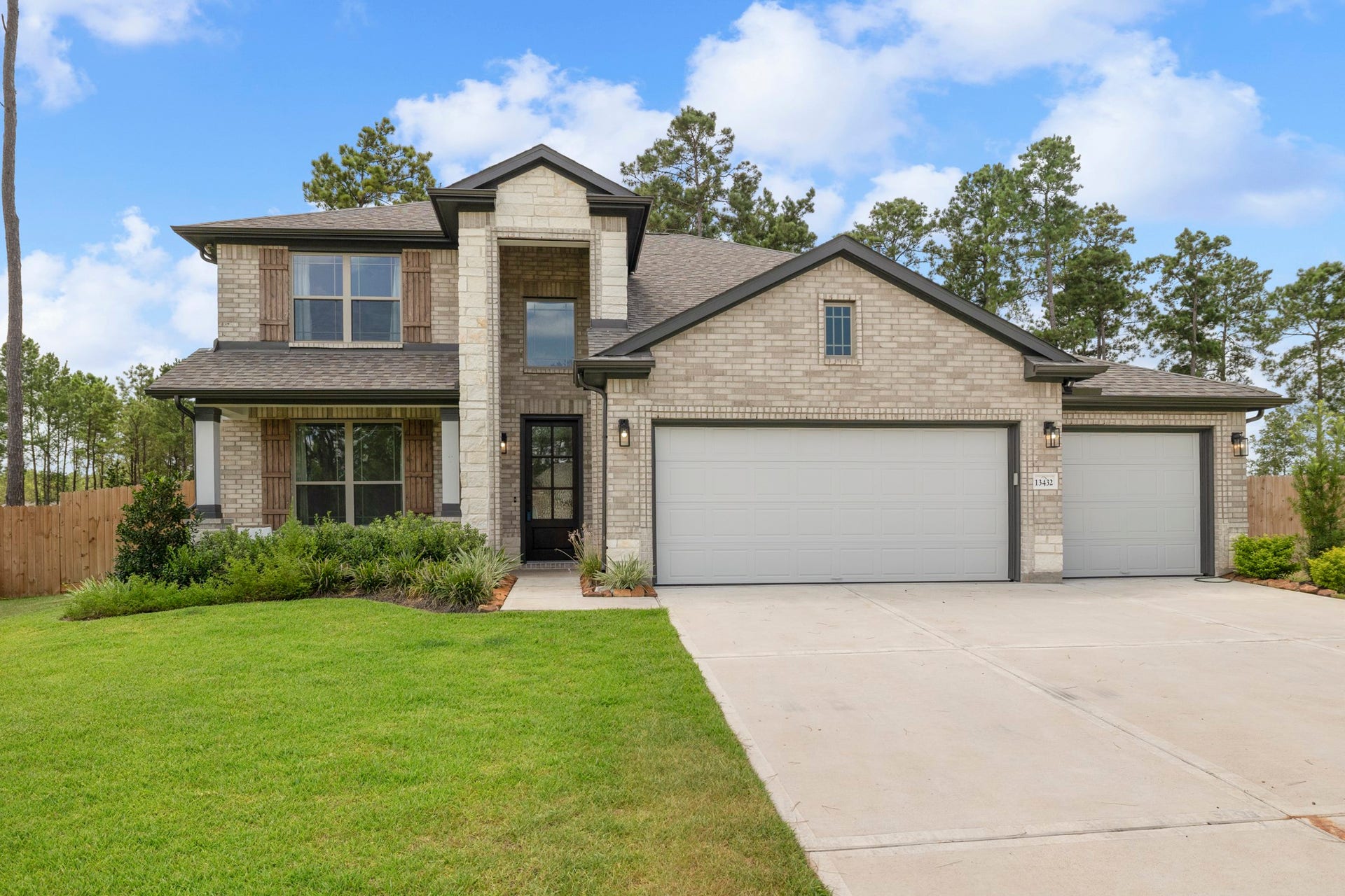 13432 Maverick Trail Road, Conroe, TX 77303 Upgraded 3-car garage with built-ins and epoxy floor finish
