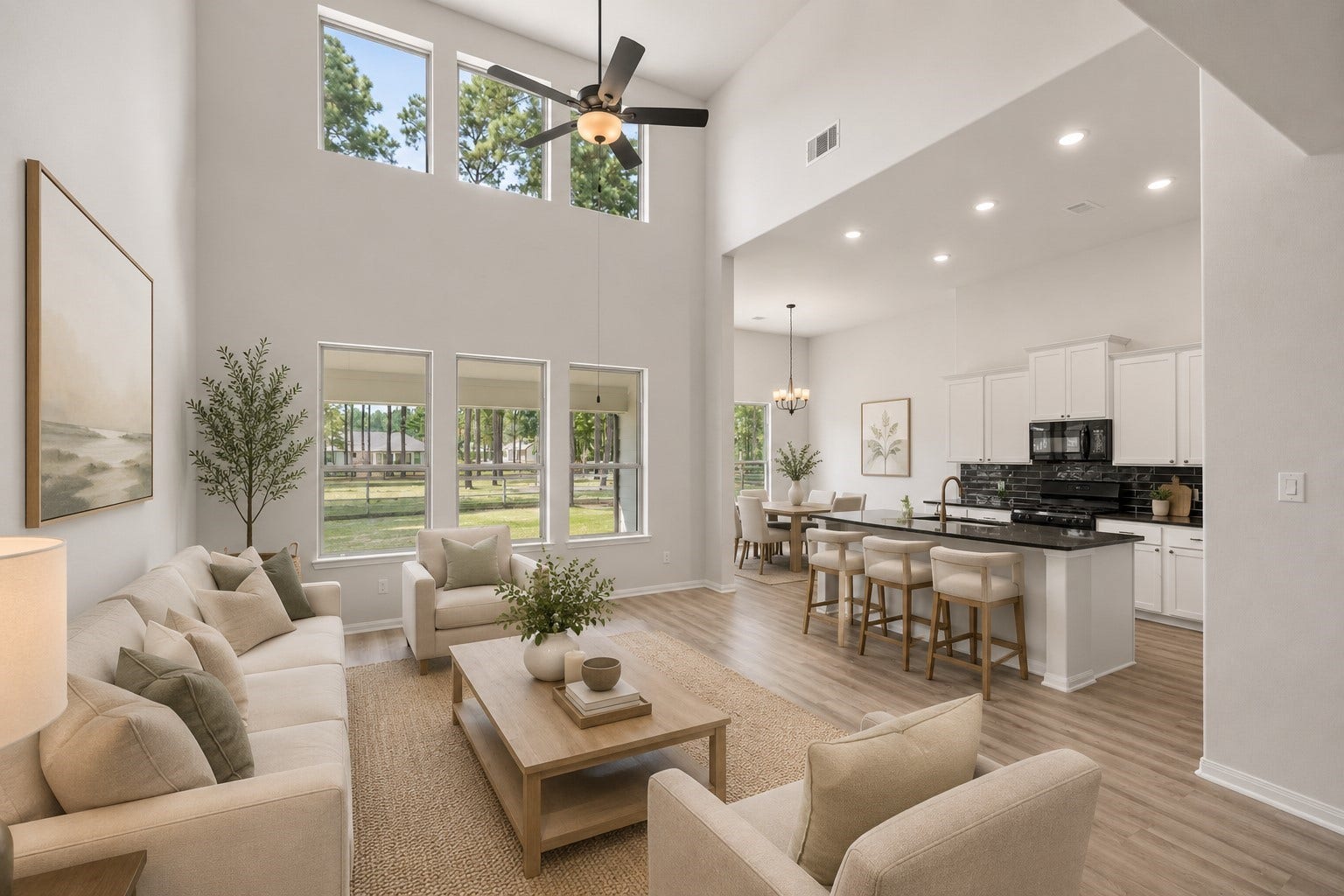 13432 Maverick Trail Road, Conroe, TX 77303 Spacious open-concept living area with soaring ceilings and abundant natural light, seamlessly connecting to a modern kitchen. *Virtually staged