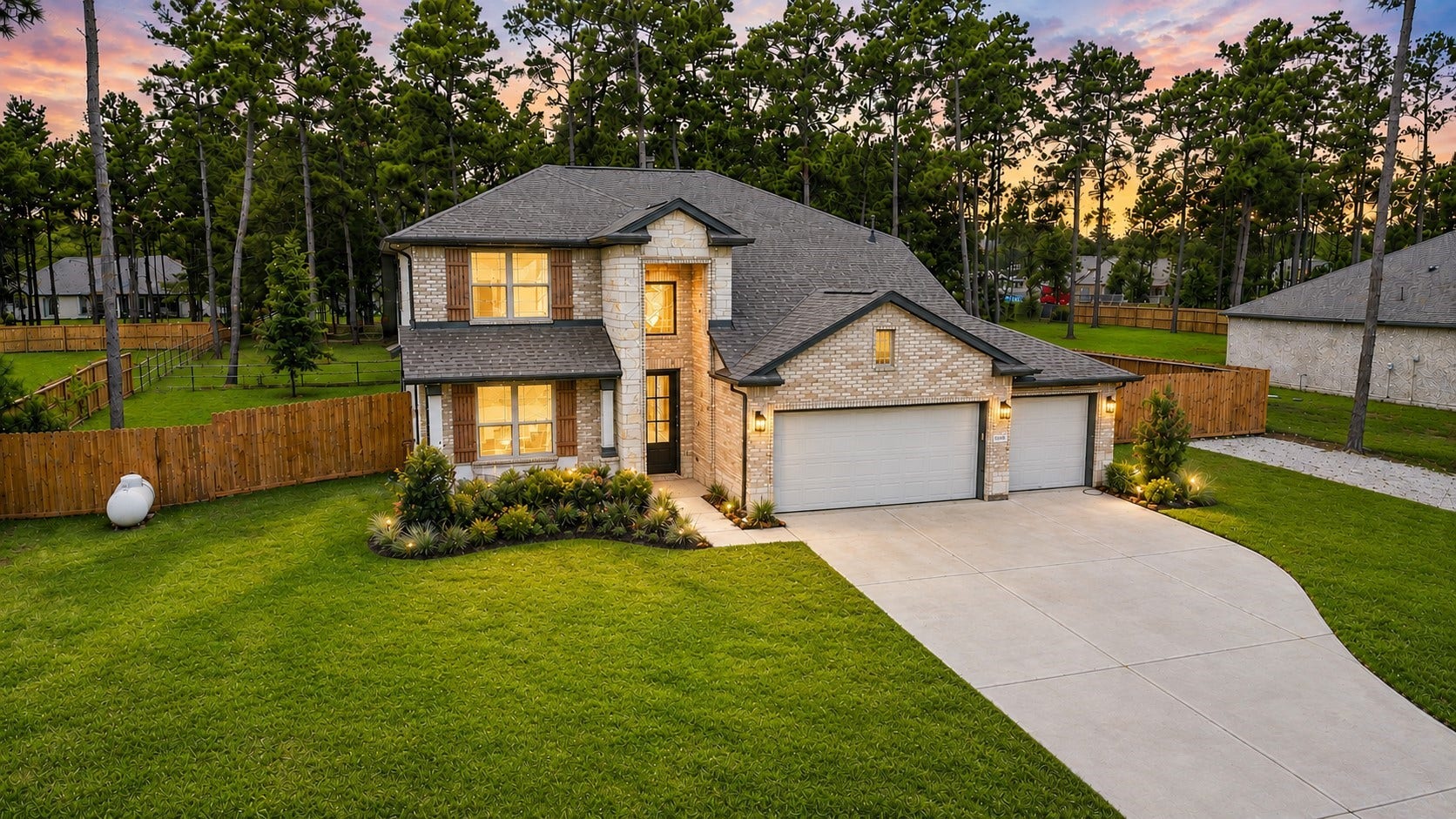 13432 Maverick Trail Road, Conroe, TX 77303 Stunning two-story home with a spacious driveway and three-car garage, nestled amidst lush greenery and mature trees, offering privacy and tranquility.