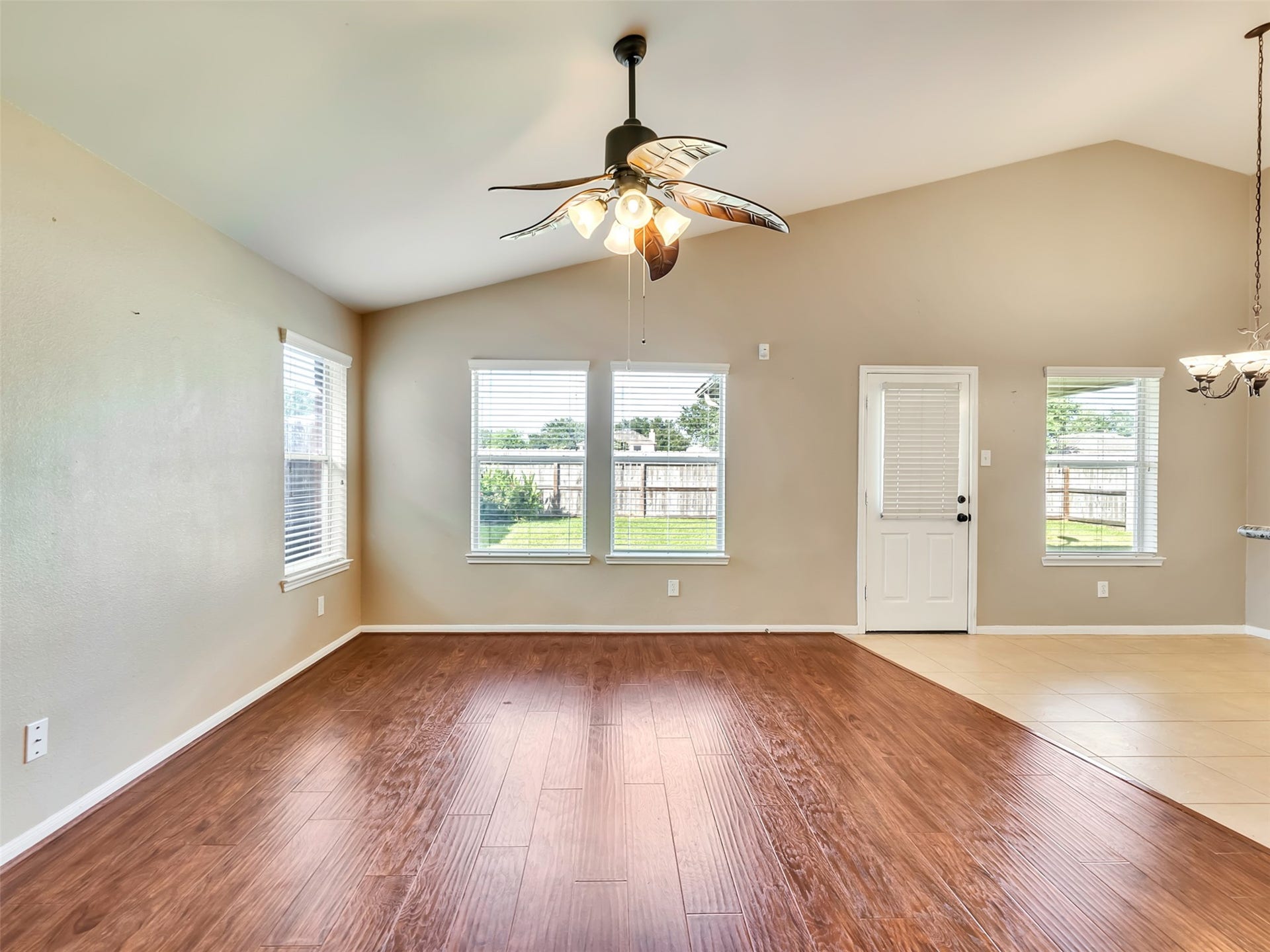 4027 Bentwood Drive, Dickinson, TX 77539 Bright and inviting living area with a back door that opens to a covered patio, creating the perfect indoor-outdoor living space.