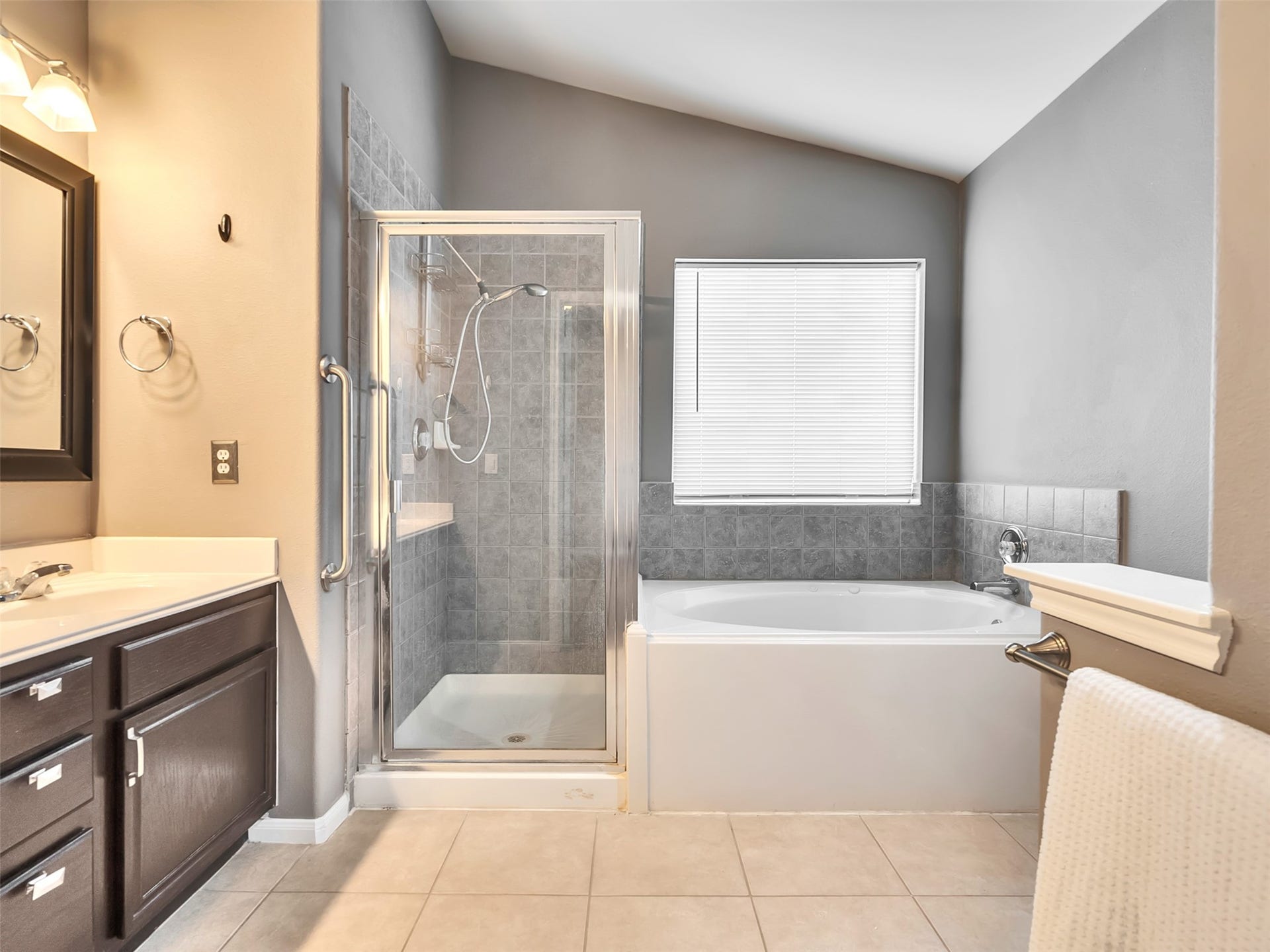 4027 Bentwood Drive, Dickinson, TX 77539 Featuring a luxurious soaking, whirlpool tub and a separate walk-in shower, this private retreat is designed for both relaxation and everyday convenience