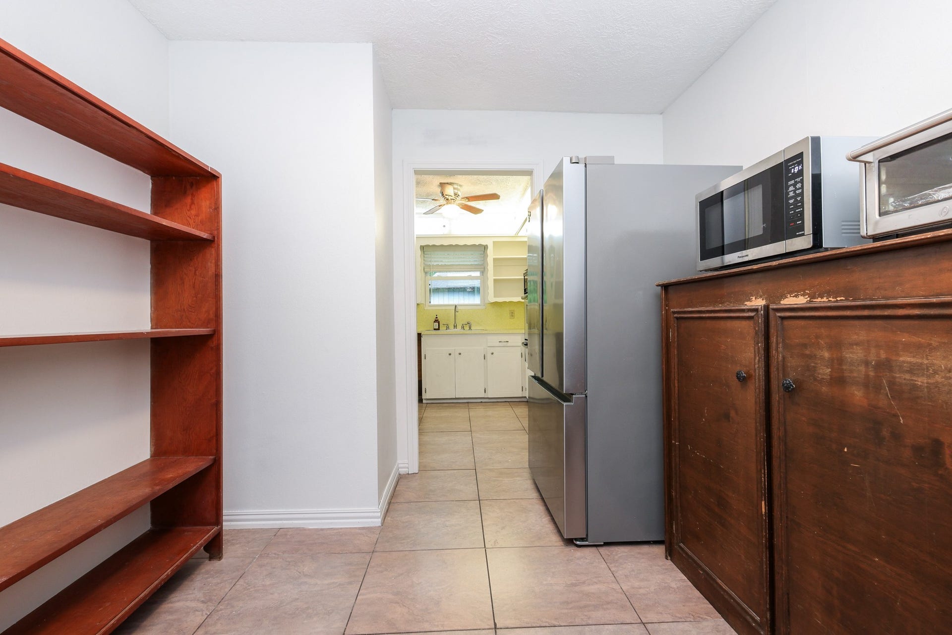 12614 C Bar Drive, Santa Fe, TX 77510 Utility Room with shelving and built-in cabinetry