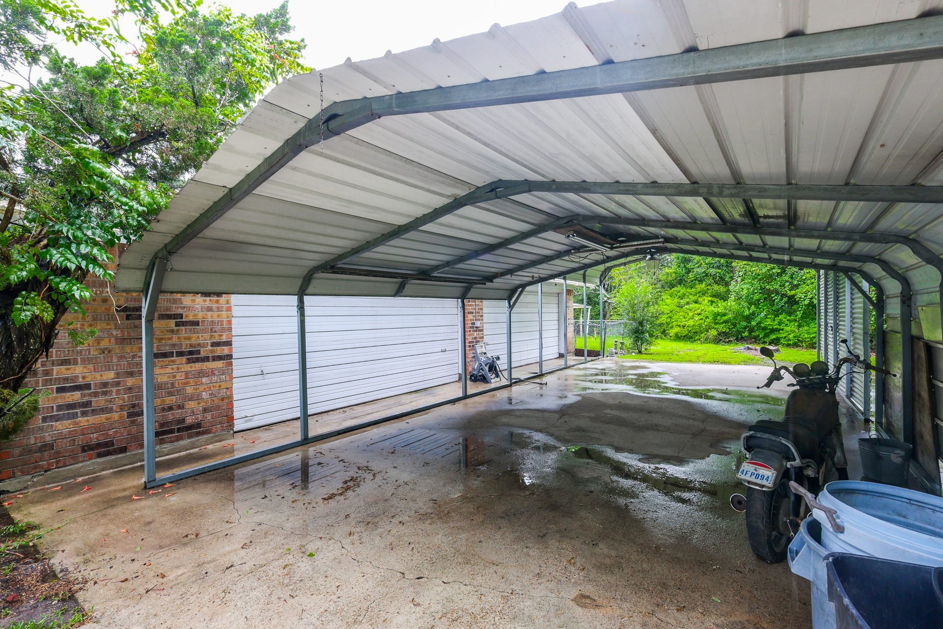 12614 C Bar Drive, Santa Fe, TX 77510 Driveway to garage with covered carports
