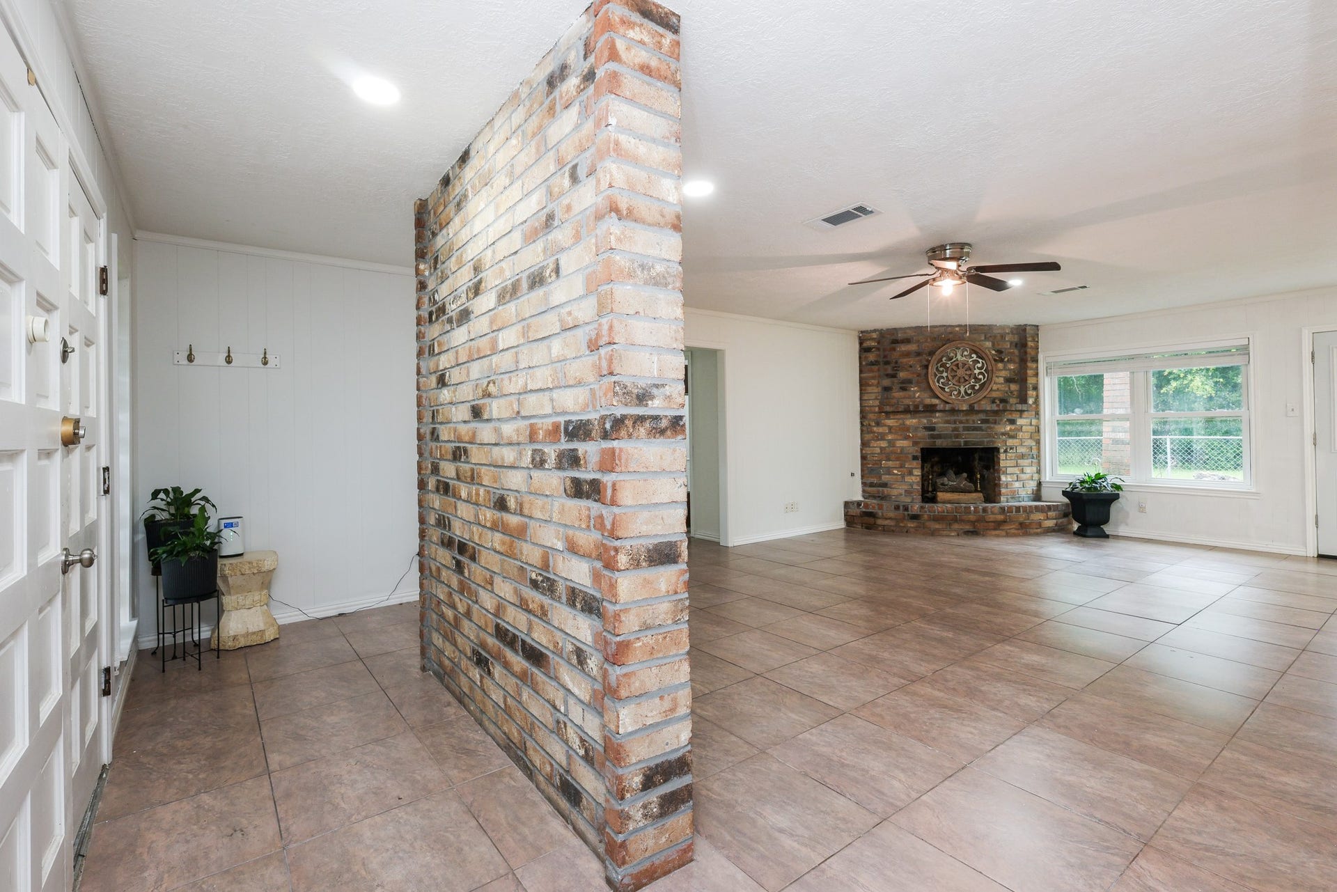 12614 C Bar Drive, Santa Fe, TX 77510 Foyer with brick wall feature to living room
