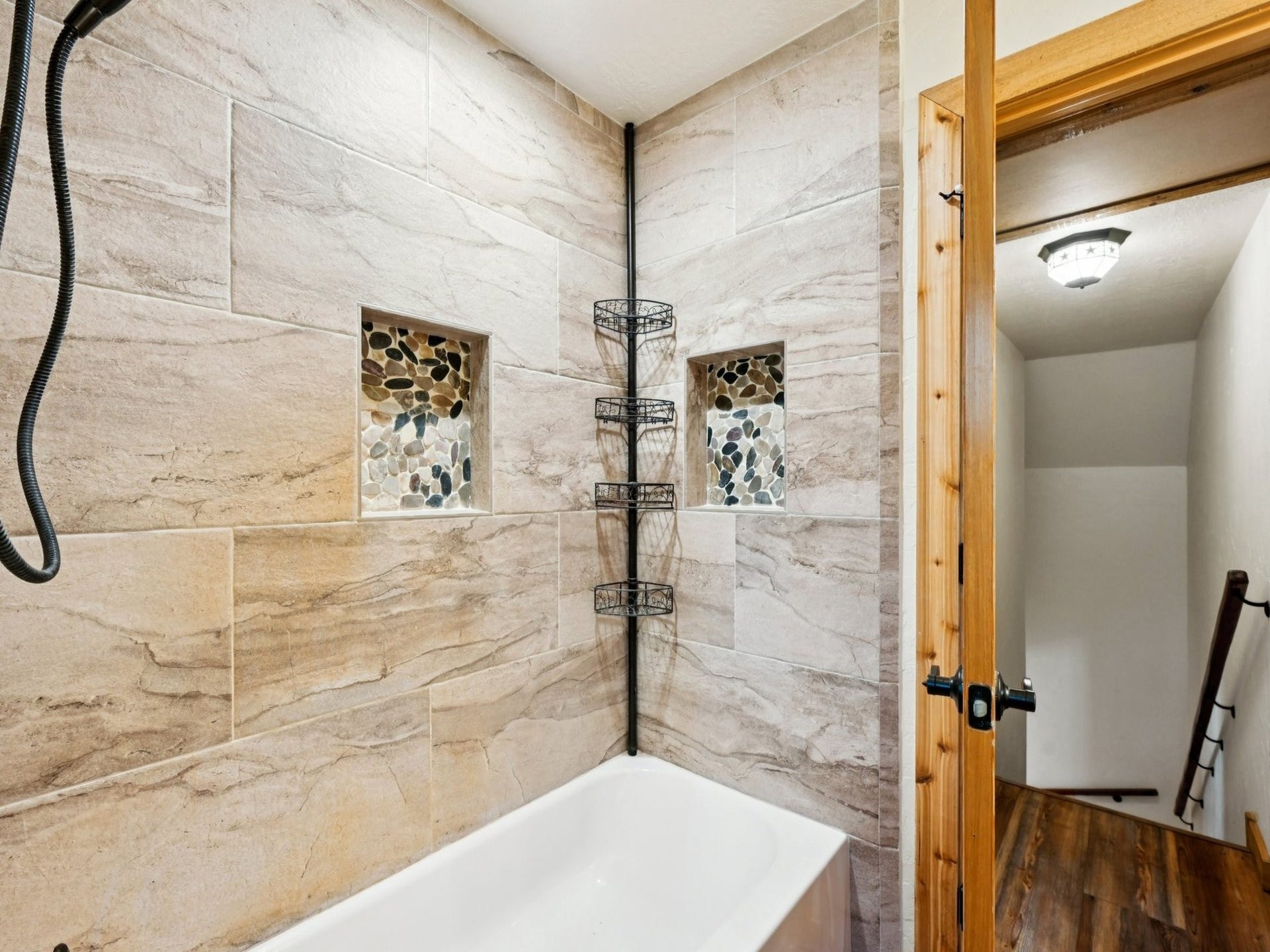 101-1/2 Avenue J, Dickinson, TX 77539 The Upstairs Bathroom has a tiled tub/shower enclosure.