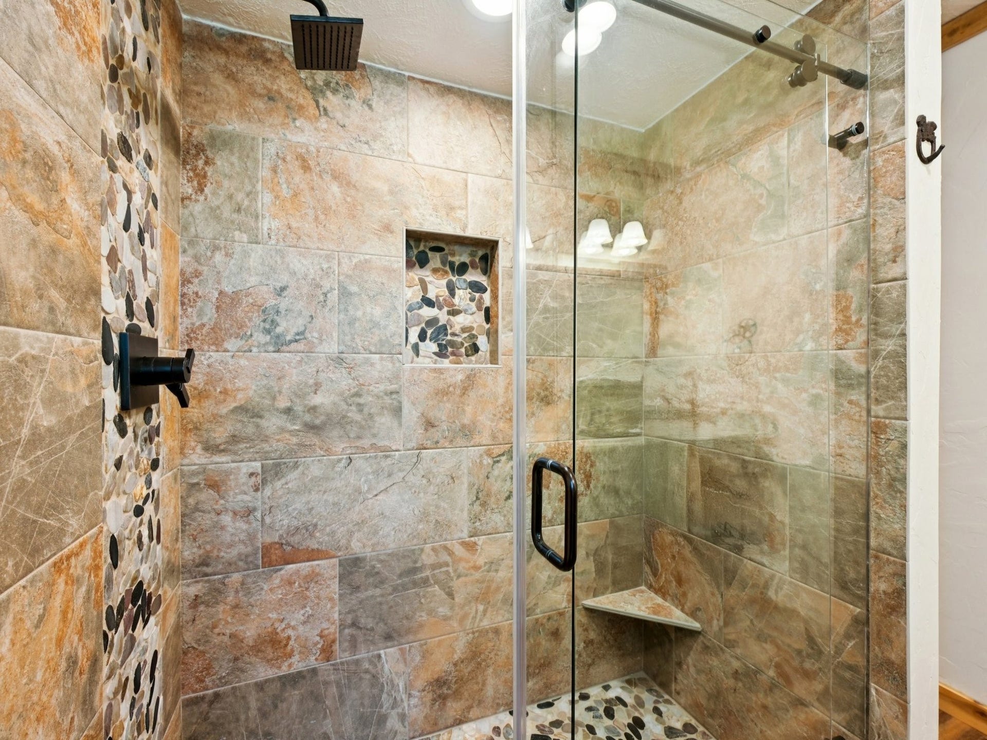 101-1/2 Avenue J, Dickinson, TX 77539 The shower has a pretty river rock floor and inlay with shampoo niche.
