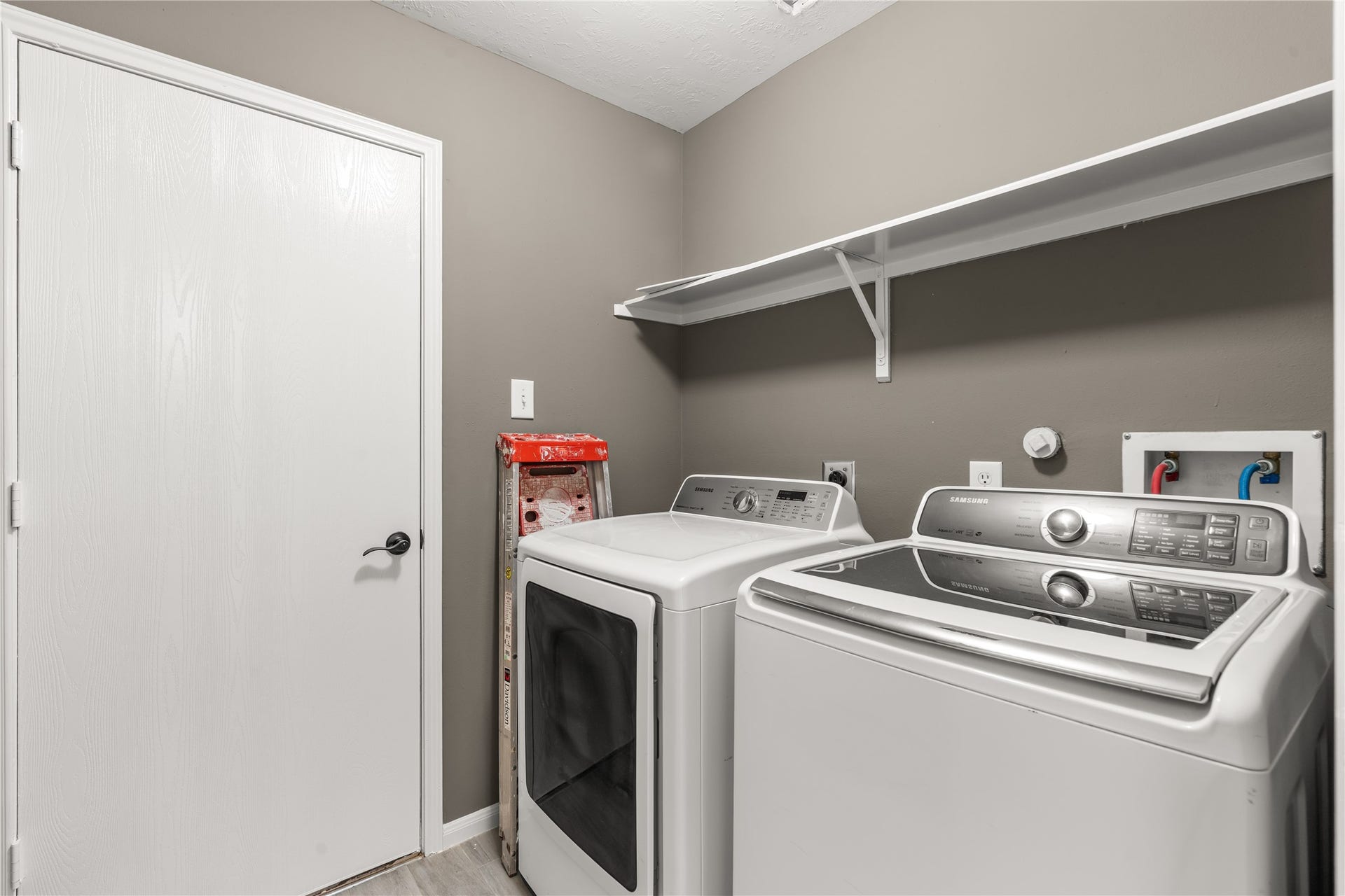 17042 Midnight Sun Lane, Richmond, TX 77407 Utility room leading to the garage. Washer and dryer included!
