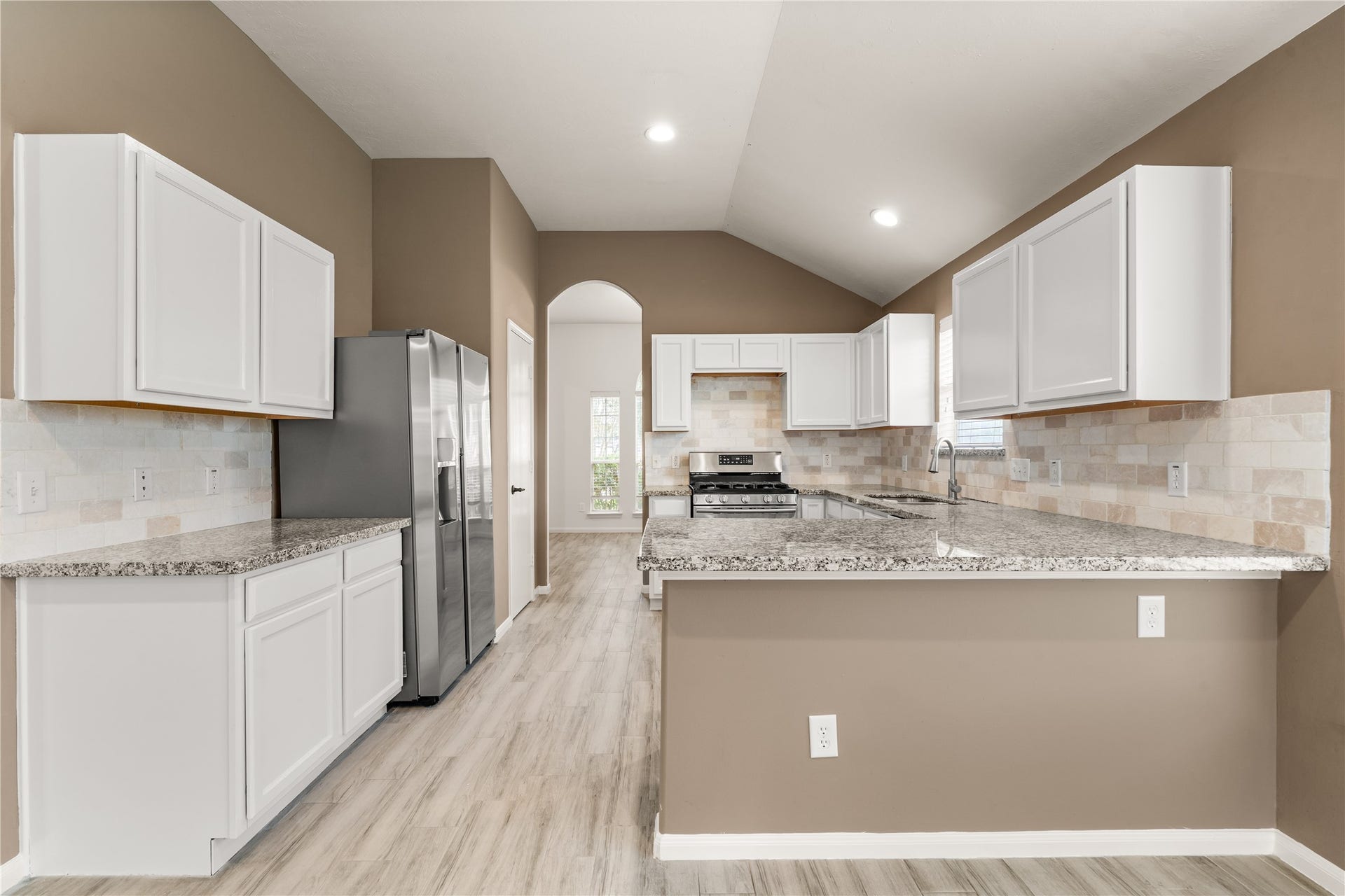 17042 Midnight Sun Lane, Richmond, TX 77407 Designed with functionality in mind, this kitchen offers abundant cabinet storage and expansive counter space.