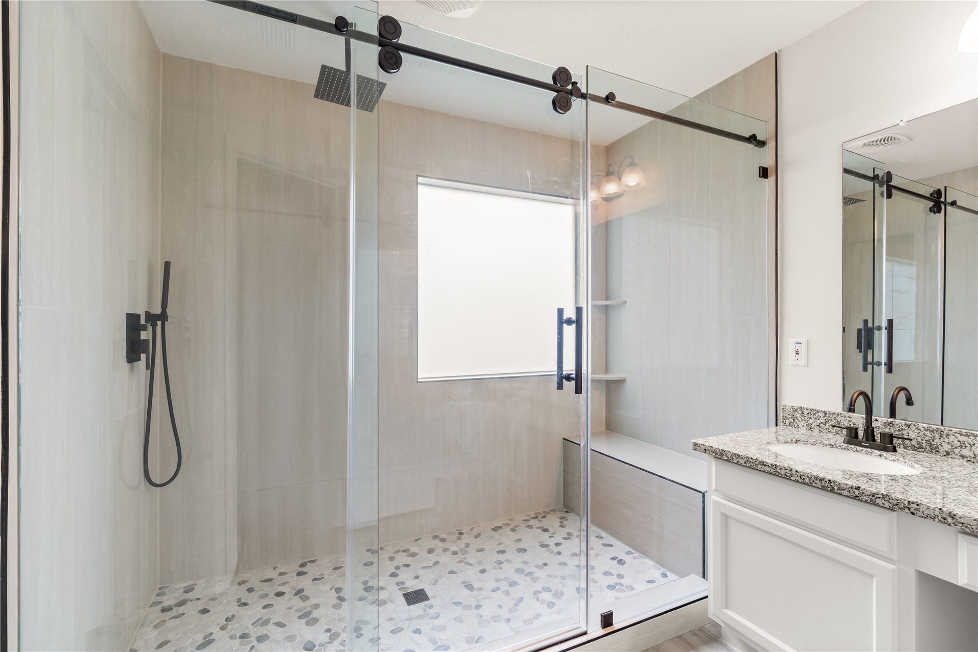 17042 Midnight Sun Lane, Richmond, TX 77407 Frameless glass shower and elegant upgrades create a spa-like retreat in the primary bath.