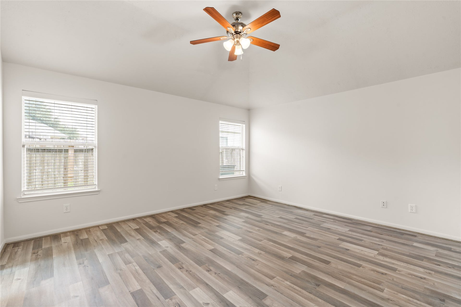 17042 Midnight Sun Lane, Richmond, TX 77407 Wake up to abundant natural light in this inviting primary bedroom.