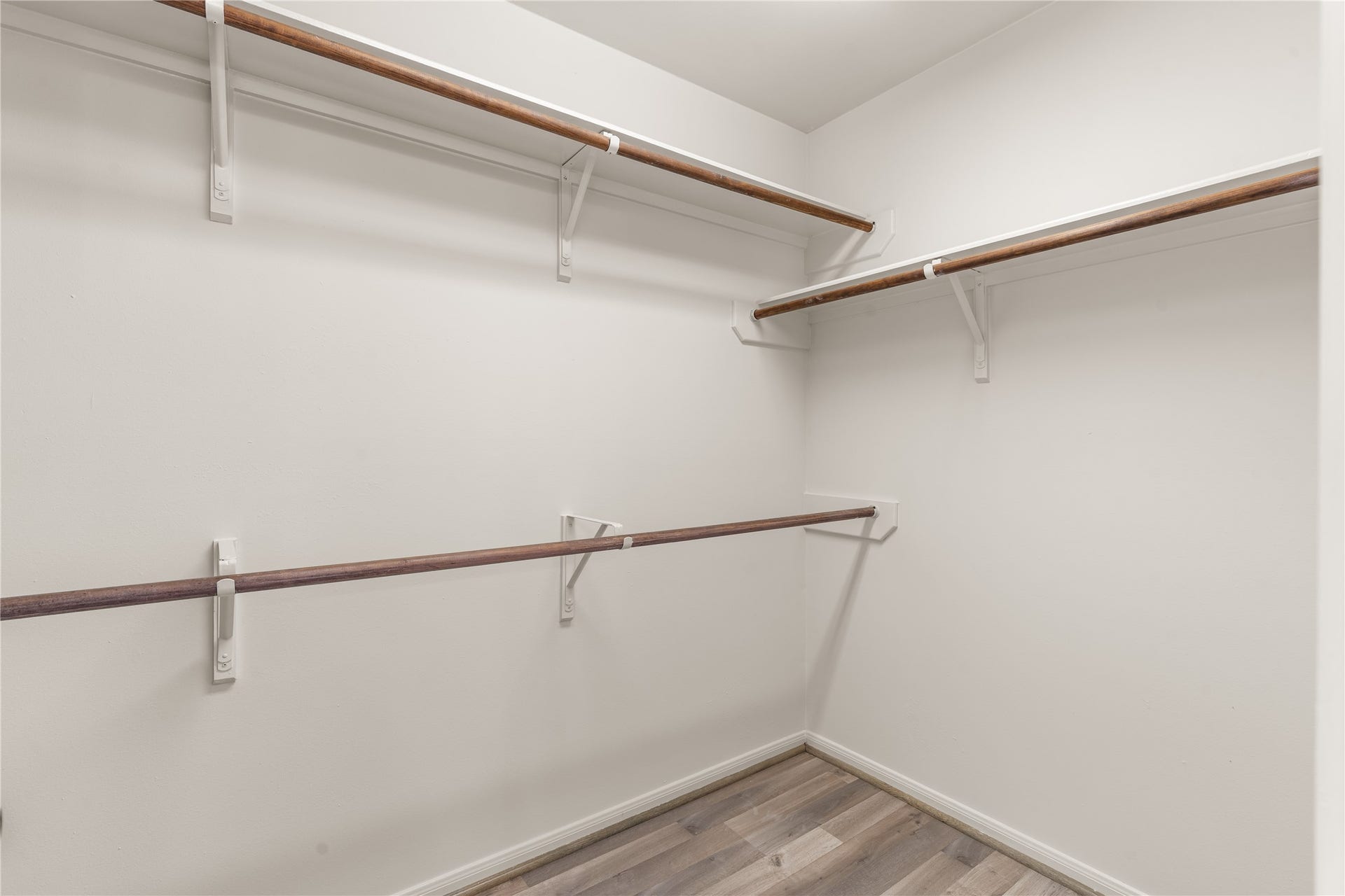 17042 Midnight Sun Lane, Richmond, TX 77407 Spacious walk-in closet with ample hanging space and plenty of room for storage and organization.