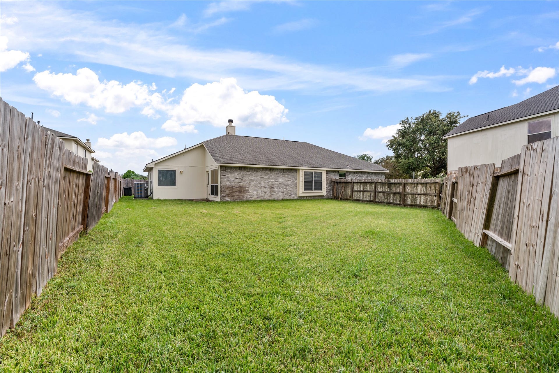 17042 Midnight Sun Lane, Richmond, TX 77407 Fully fenced backyard with plenty of space for outdoor entertaining, pets, gardening, or play.