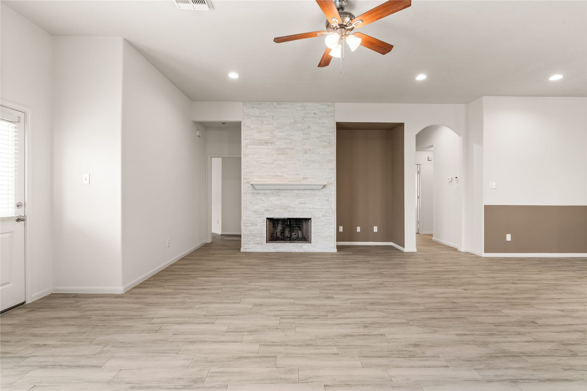 17042 Midnight Sun Lane, Richmond, TX 77407 The centrally located fireplace serves as a warm focal point for the main living space.