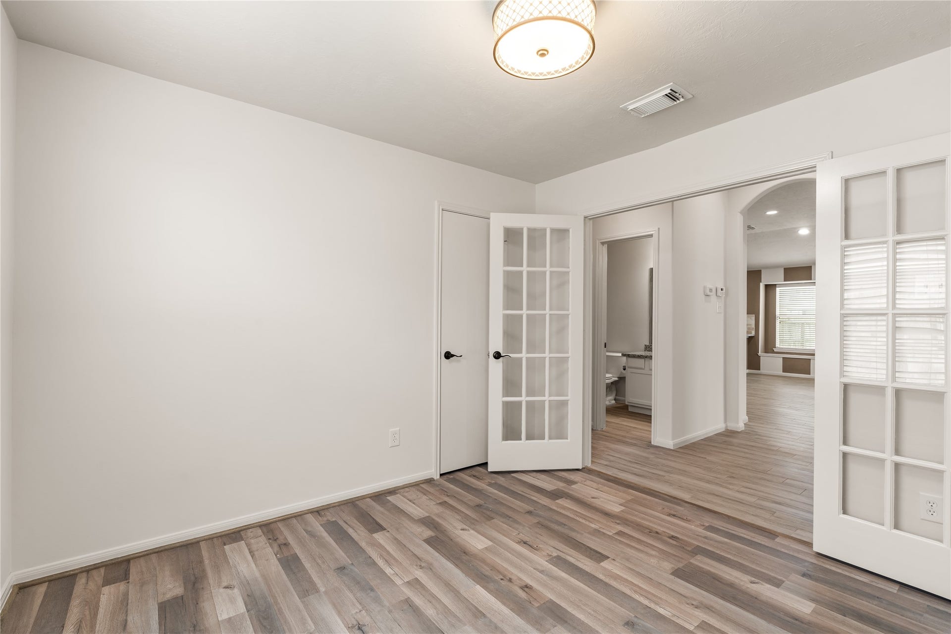 17042 Midnight Sun Lane, Richmond, TX 77407 Flexible home office/ study enclosed by French doors.