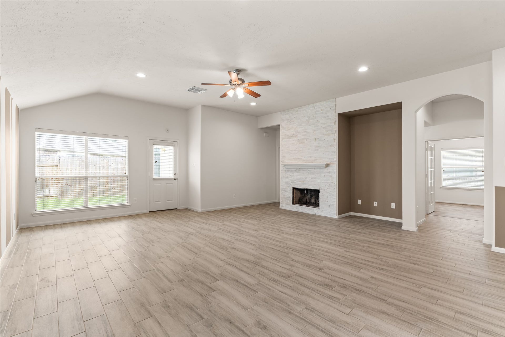 17042 Midnight Sun Lane, Richmond, TX 77407 Multiple windows along the rear of the home bring in natural light and provide views of the backyard.