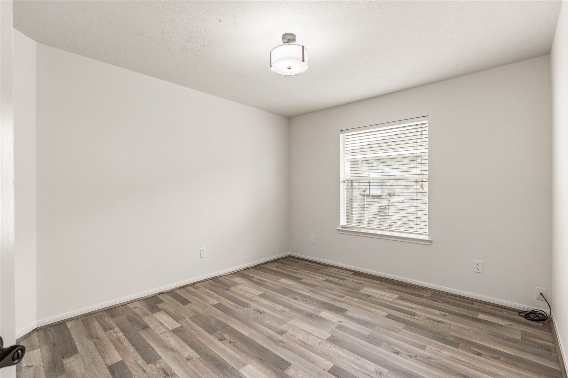 17042 Midnight Sun Lane, Richmond, TX 77407 Large window fills the room with natural light, creating a bright and welcoming environment.