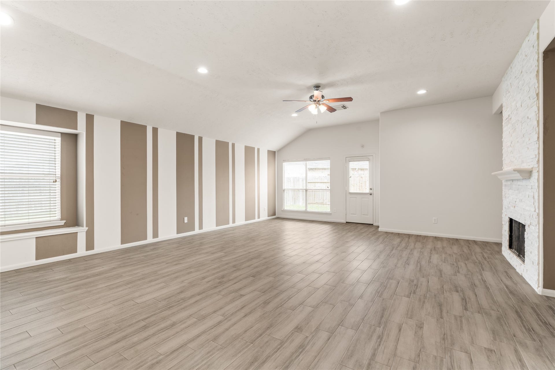 17042 Midnight Sun Lane, Richmond, TX 77407 Generously sized living room with an open layout that's perfect for everyday living and entertaining.