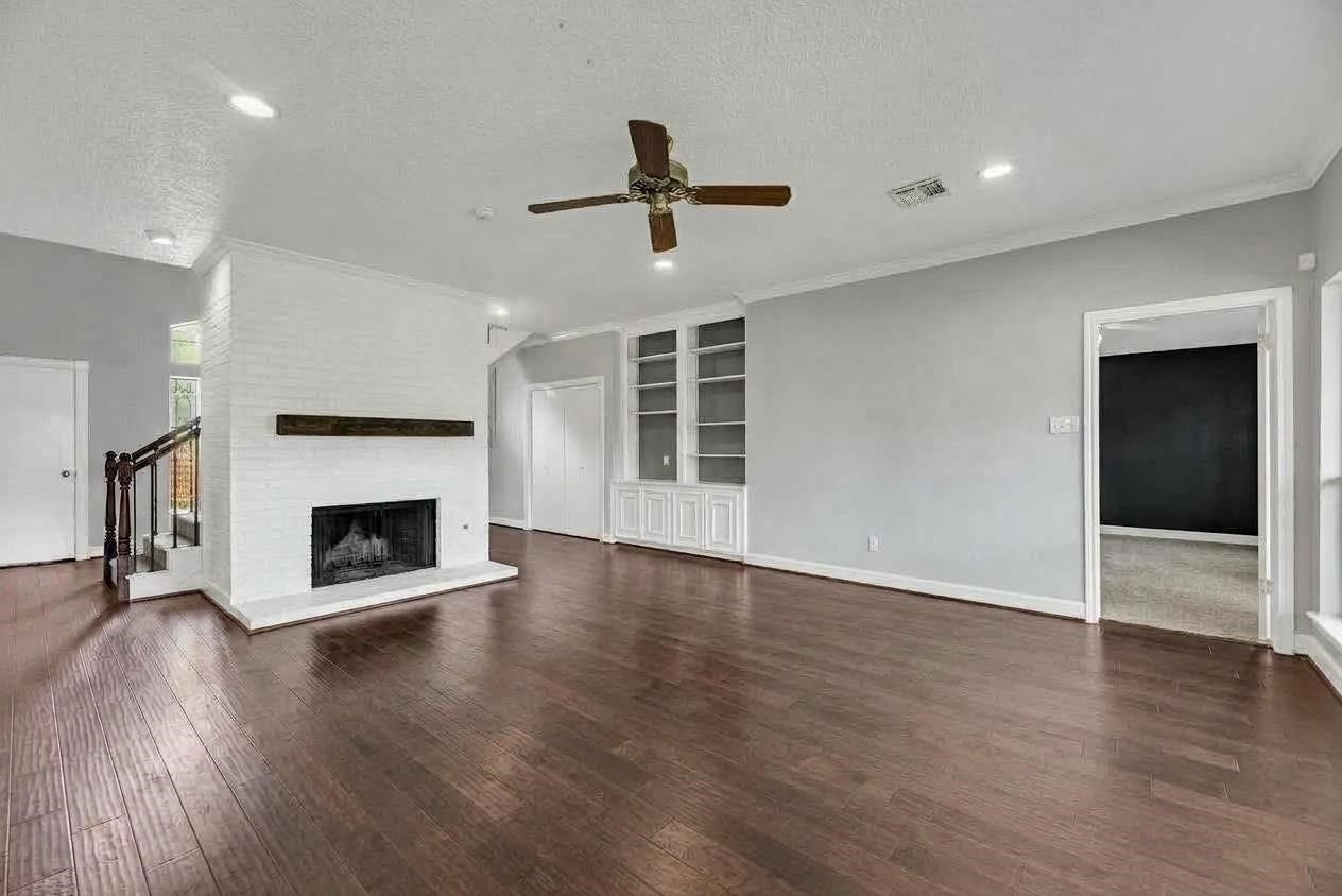 1523 Plantation Drive, Richmond, TX 77406 Family room shown unfurnished.