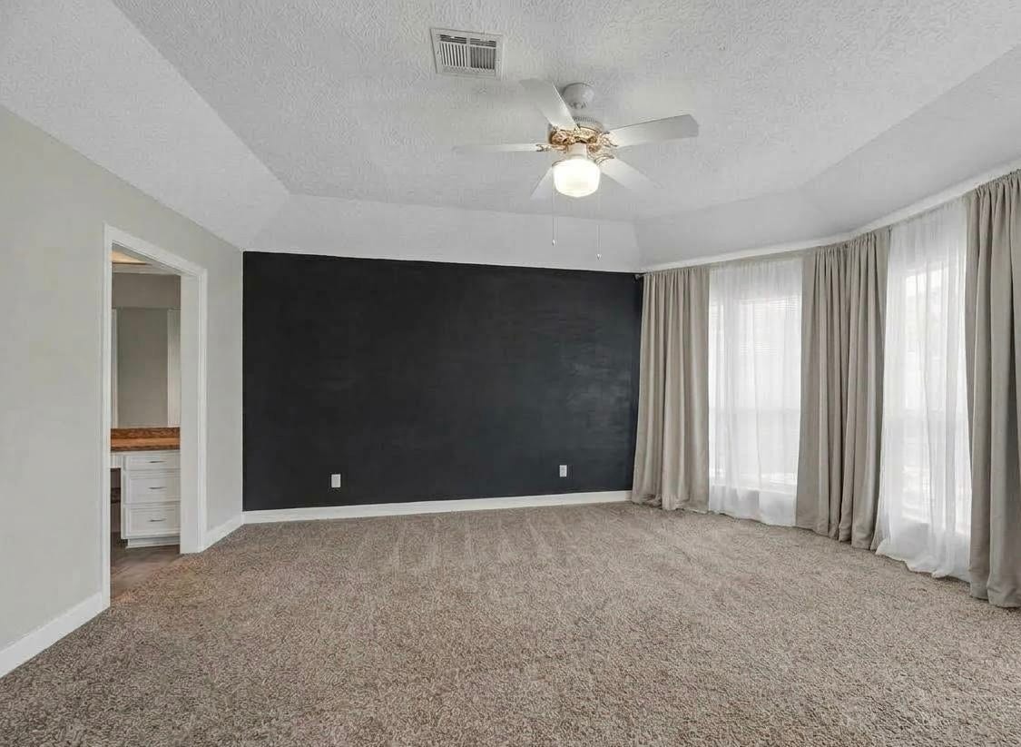 1523 Plantation Drive, Richmond, TX 77406 Primary suite shown unfurnished.