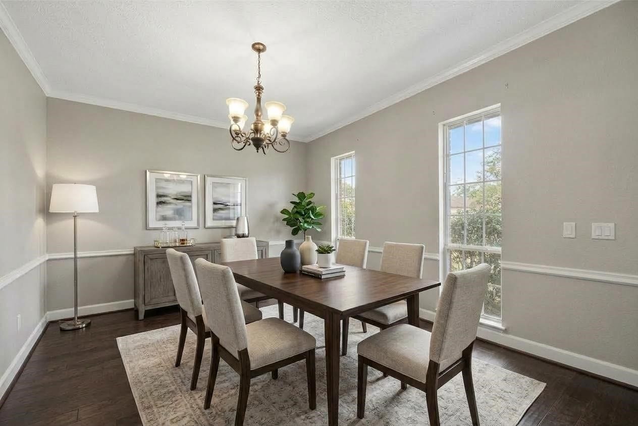 1523 Plantation Drive, Richmond, TX 77406 Dining room with windows out
to the front of the home, doorway to both kitchen and foyer. Shown virtually staged.