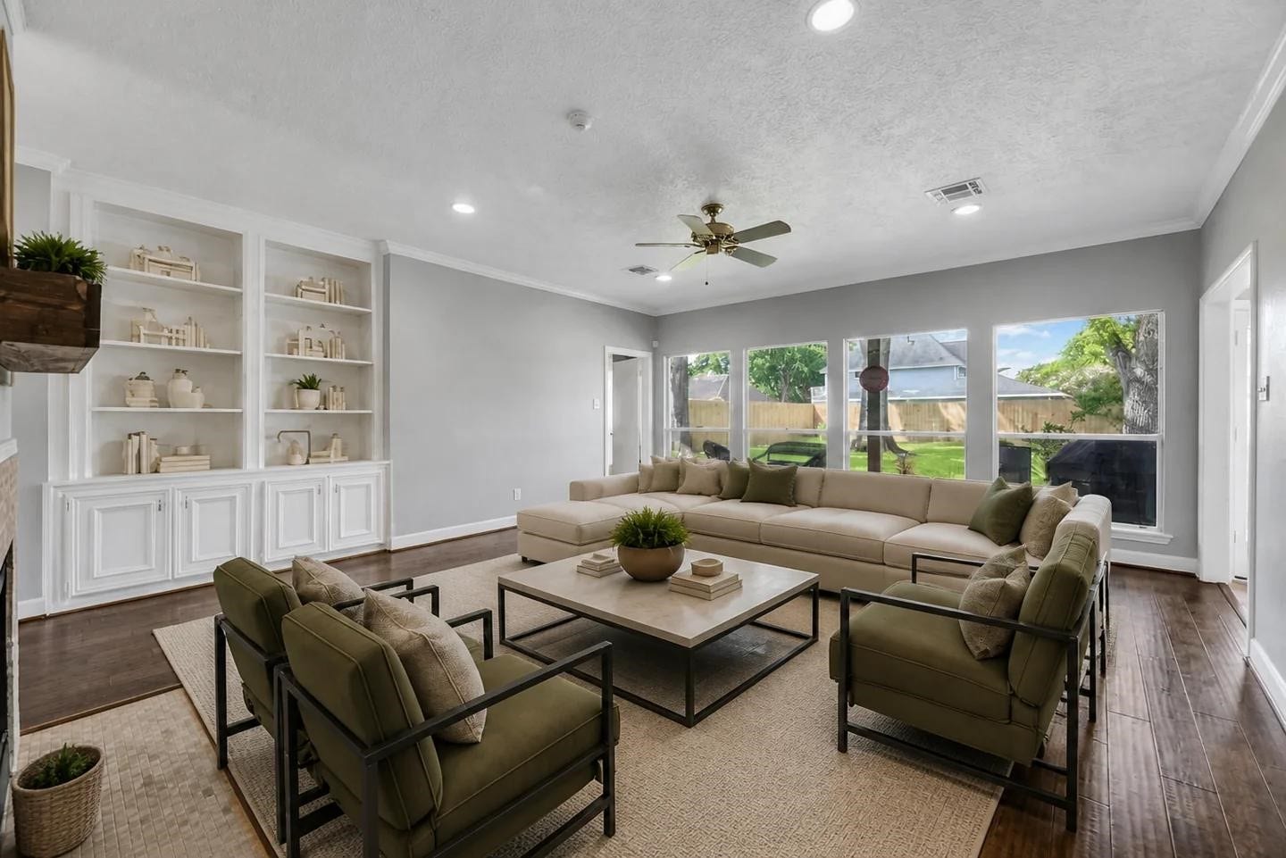 1523 Plantation Drive, Richmond, TX 77406 Family Room with large windows looking out to the backyard. Shown virtually staged.