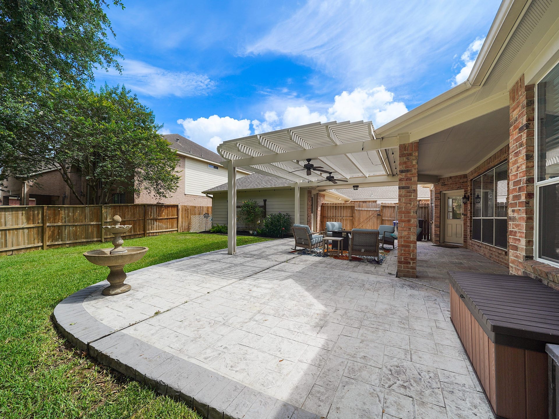 26214 Seminole Hill Lane, Katy, TX 77494 The extended patio creates a seamless transition between indoor and outdoor living, offering plenty of room for dining, entertaining, and everyday enjoyment.