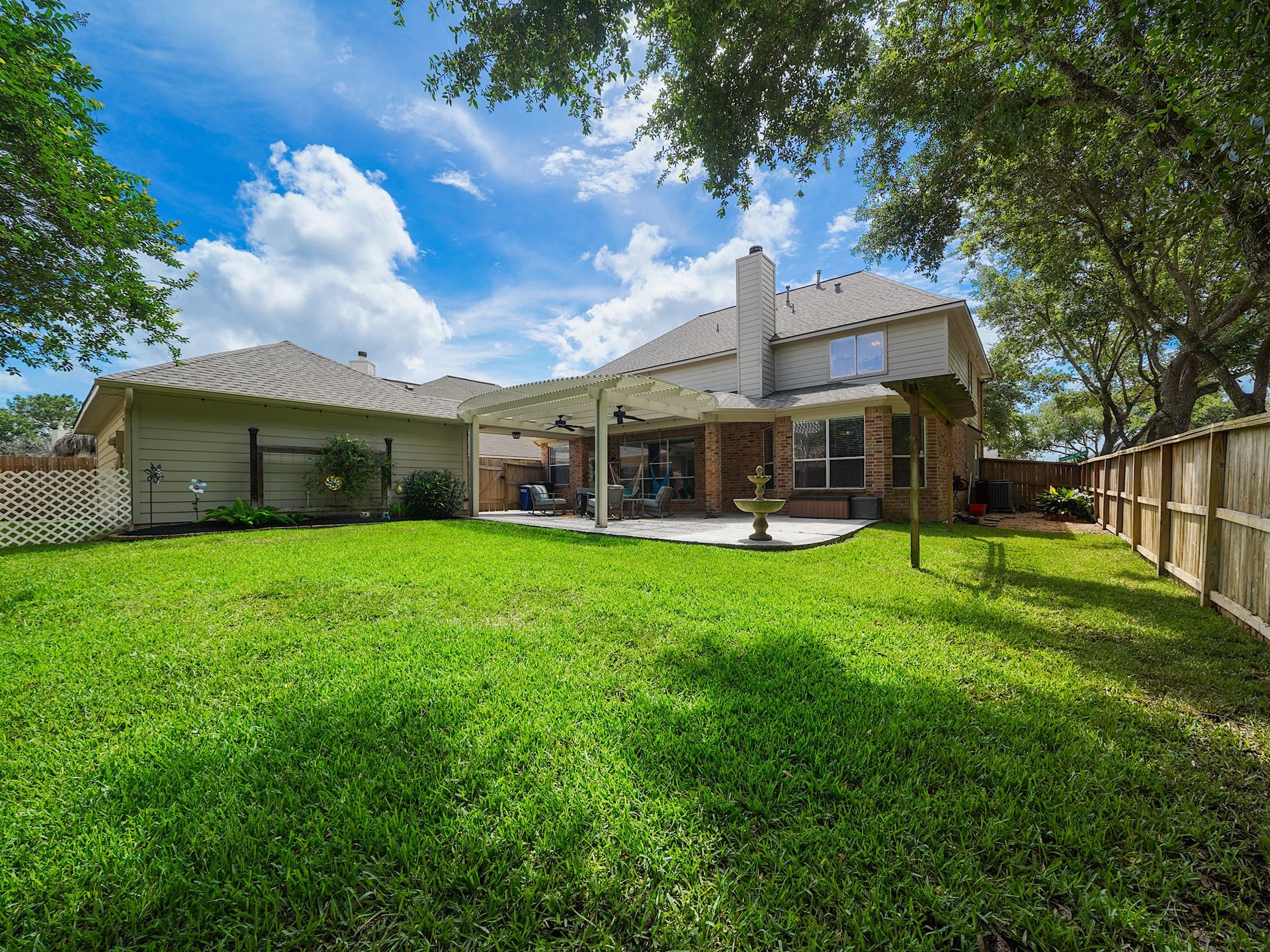 26214 Seminole Hill Lane, Katy, TX 77494 Recently refreshed landscaping enhances this spacious backyard, creating a serene setting with room to play, garden, or simply unwind.