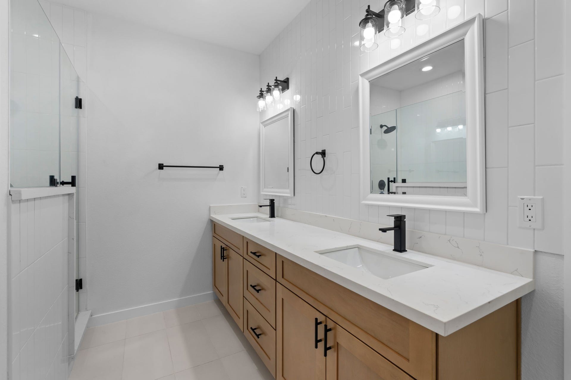 1303 Hawthorne Street, Baytown, TX 77520 Spa-like primary bath with a double vanity and floor-to-ceiling tile