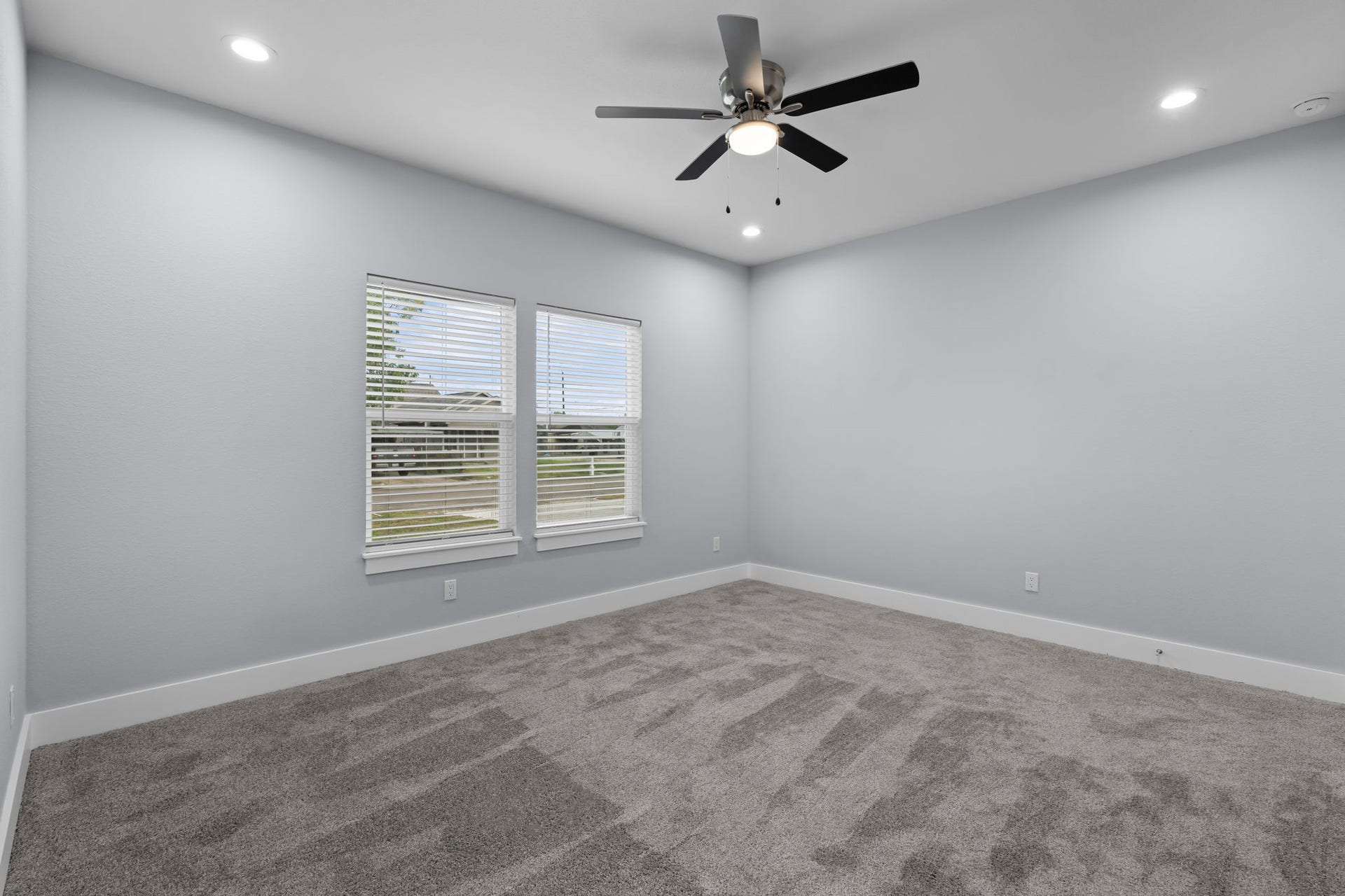 1303 Hawthorne Street, Baytown, TX 77520 Secondary bedroom with plush carpet and a ceiling fan