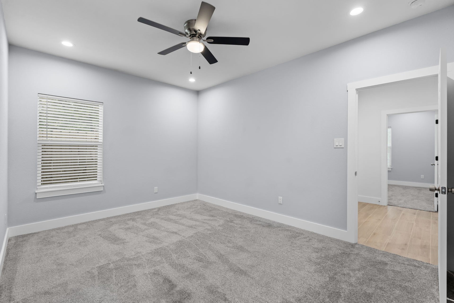1303 Hawthorne Street, Baytown, TX 77520 Third bedroom with a ceiling fan and good natural light