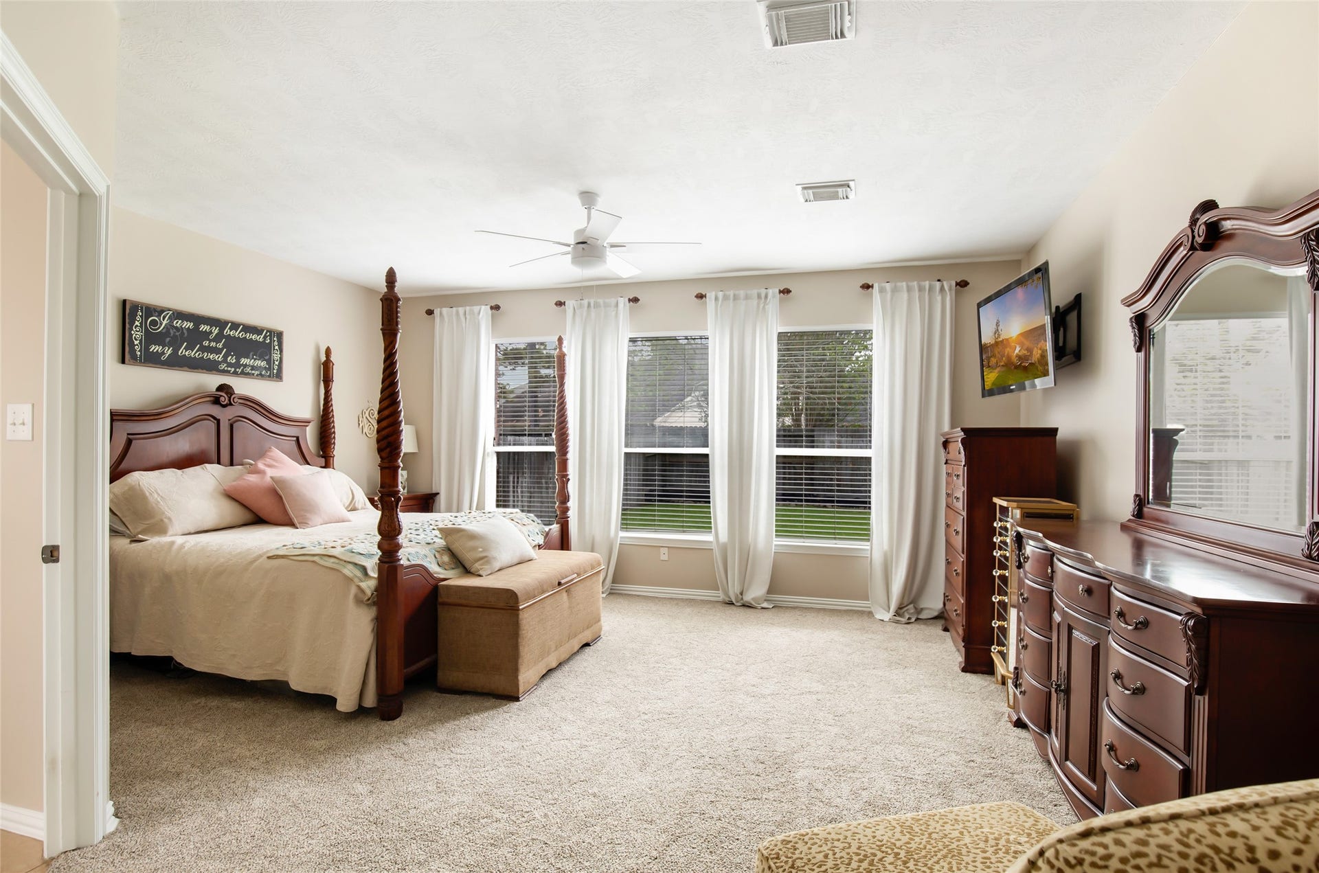 14422 Country Haven Court, Houston, TX 77044 Spacious primary bedroom featuring plush carpeting and abundant natural light