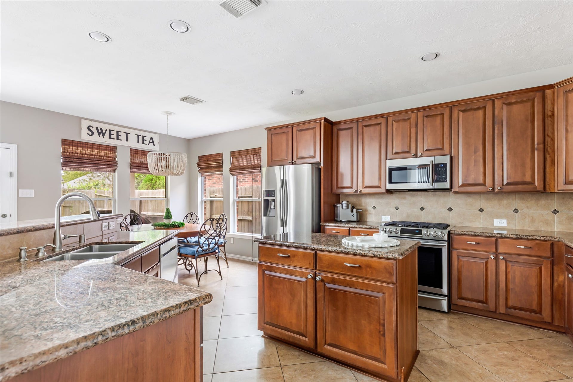 14422 Country Haven Court, Houston, TX 77044 Kitchen with abundant wood cabinetry, generous counter space and stainless steel appliances