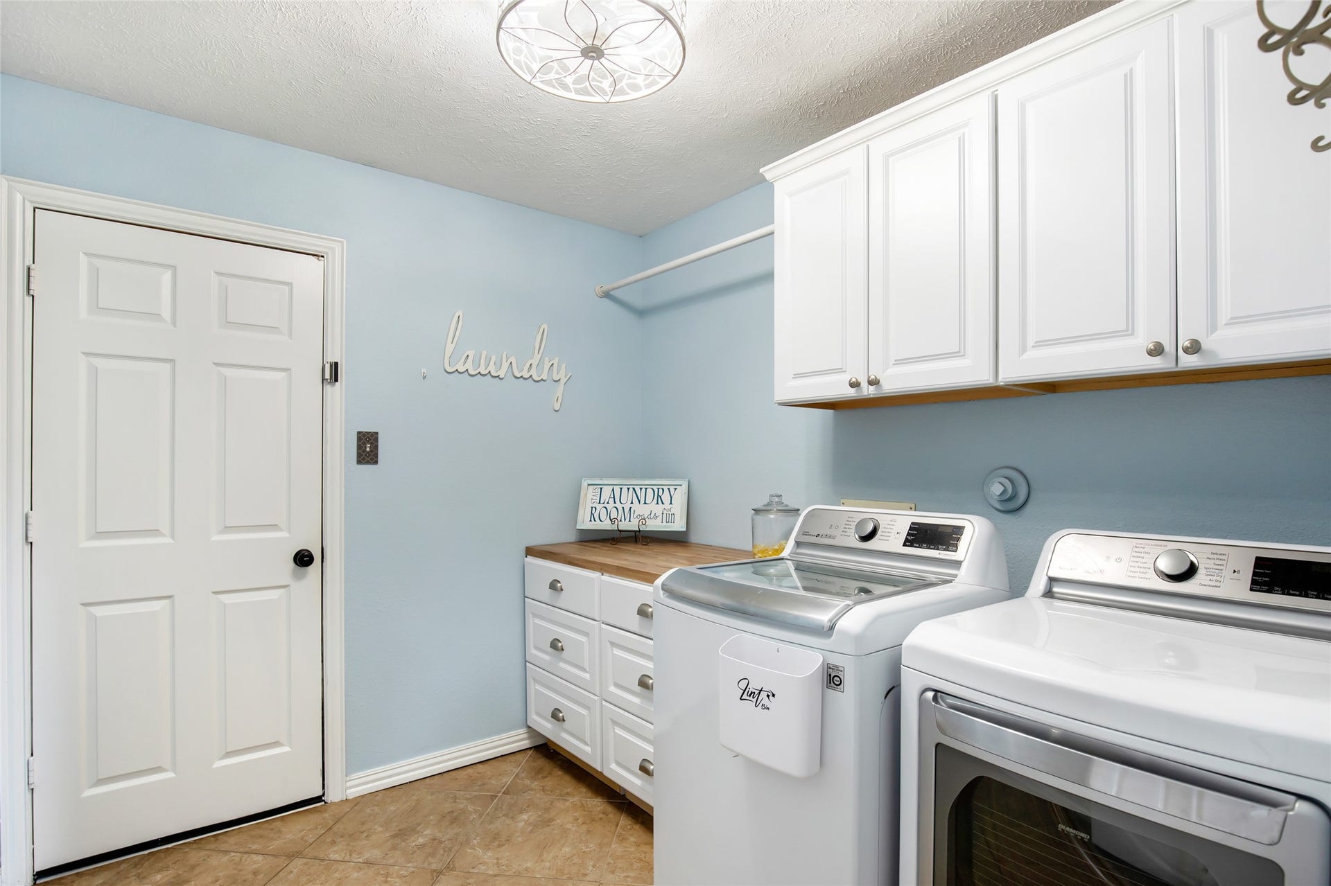 14422 Country Haven Court, Houston, TX 77044 Dedicated utility room with cabinetry, countertop space and room for laundry appliances