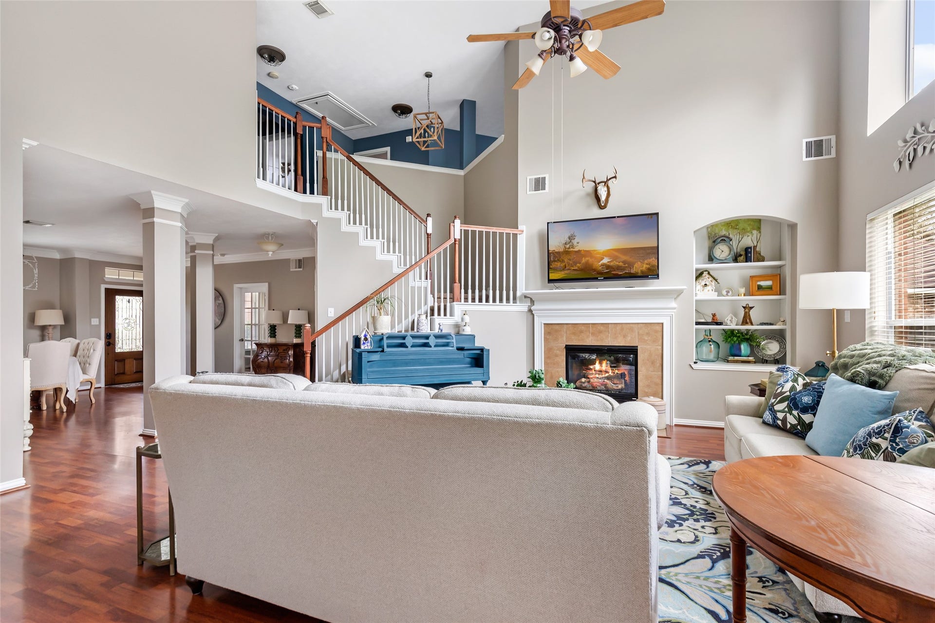 14422 Country Haven Court, Houston, TX 77044 Open-concept living area showcasing the two-story ceiling and open staircase