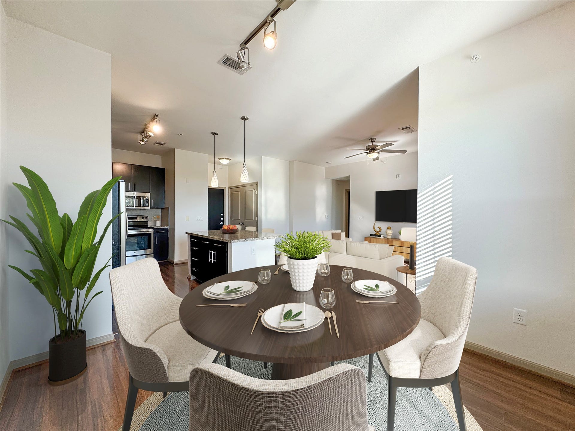 2700 Brazos Street, #4201, Houston, TX 77006 Open space between kitchen and living room. Stainless steel appliances and granite countertops with a dinning bar.