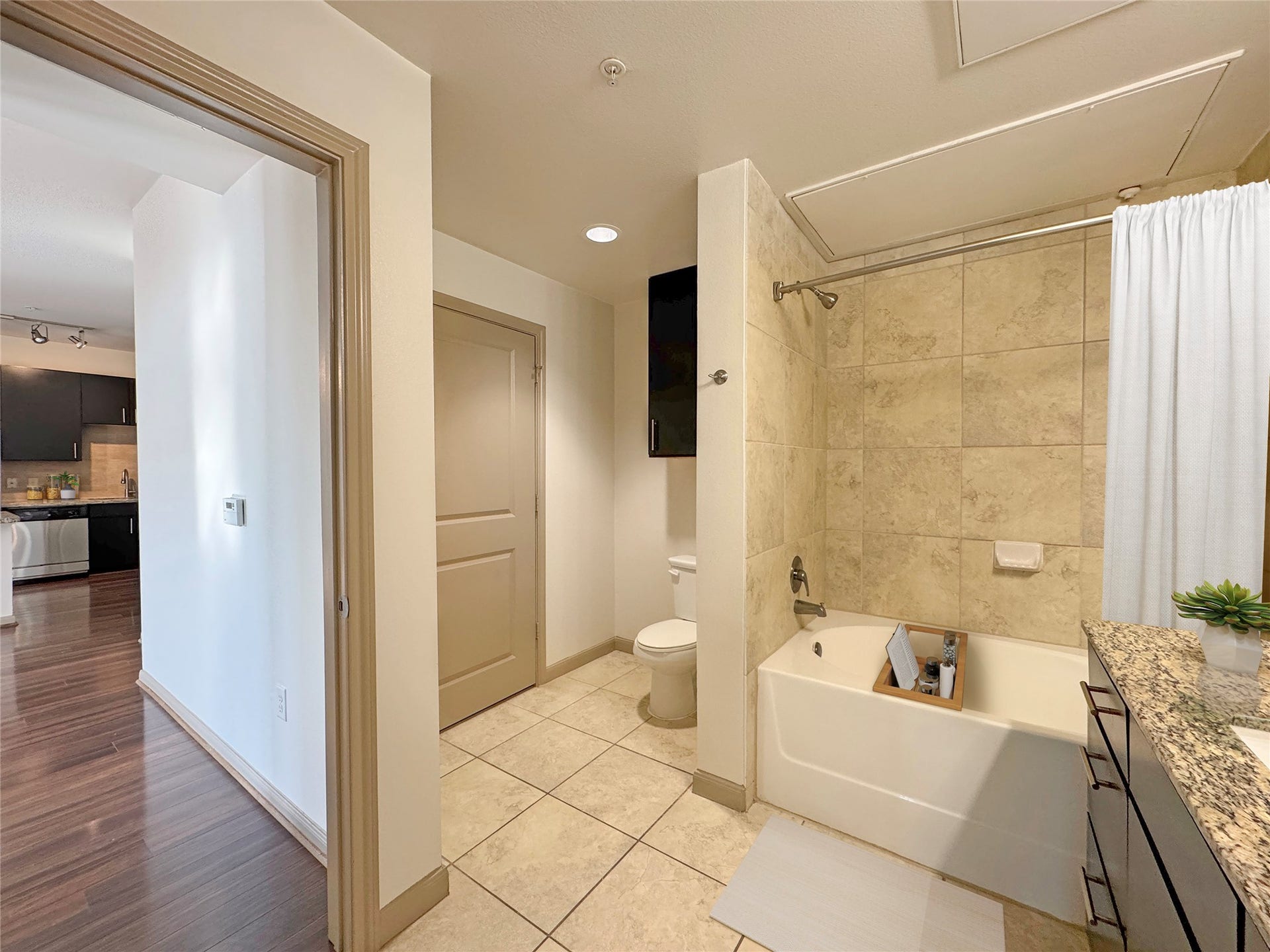 2700 Brazos Street, #4201, Houston, TX 77006 Shower-tub combo. Vanity has plenty of extra storage.