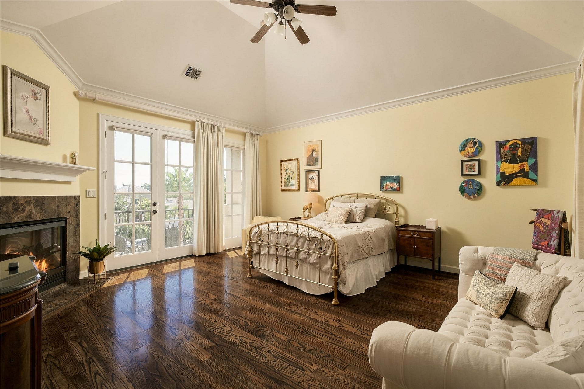 523 Lovett Boulevard, Houston, TX 77006 The primary suite feels almost like its own apartment, with a vaulted ceiling, fireplace, sitting area and French doors extending the room outdoors.