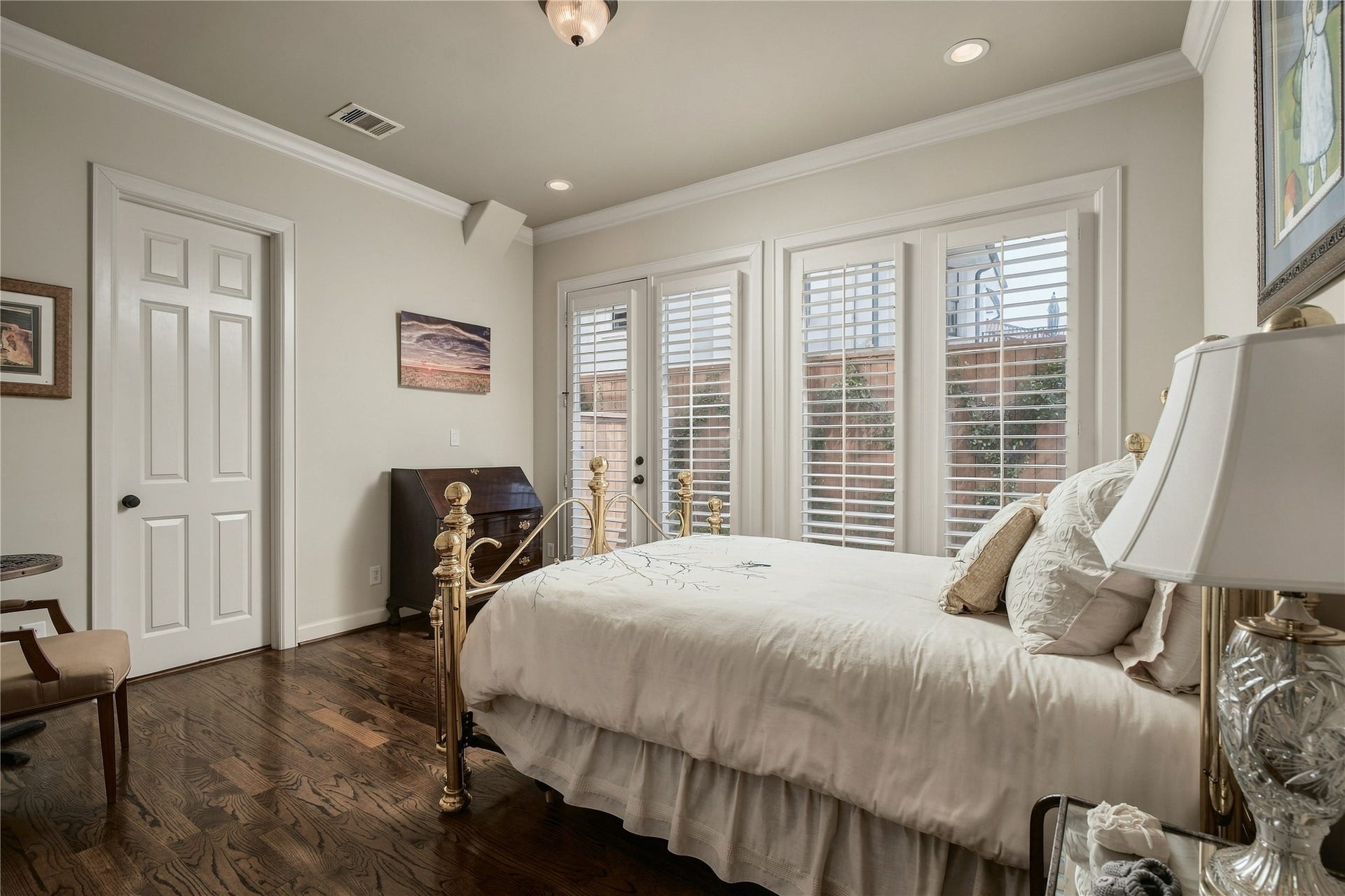523 Lovett Boulevard, Houston, TX 77006 The second first-floor bedroom has a different feel entirely, with French doors bringing in natural light and creating an unexpected connection to the outdoors.