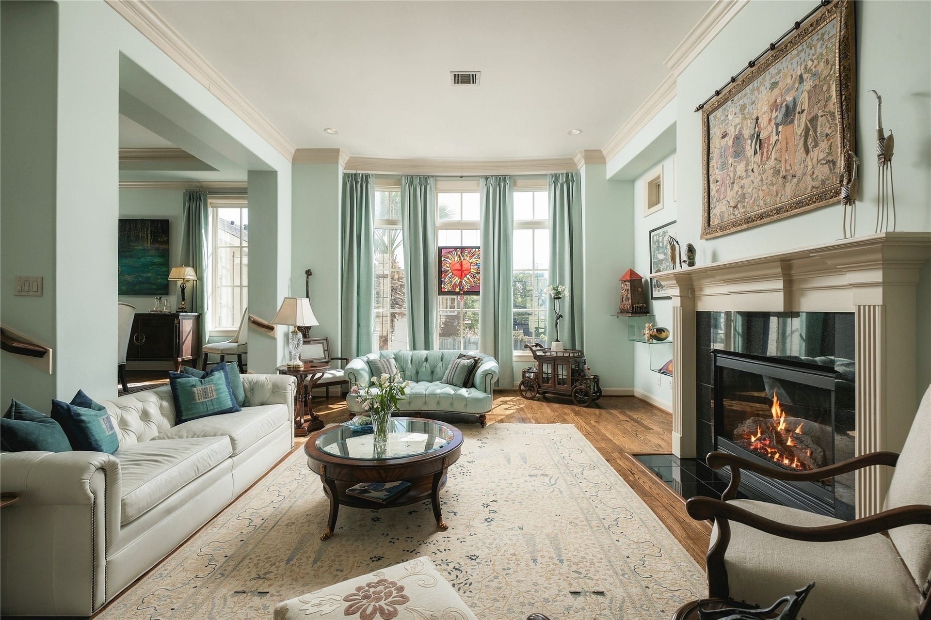 523 Lovett Boulevard, Houston, TX 77006 This is the kind of living room that works just as well for a quiet night at home as it does with a house full of people, without needing to change how the space lives.