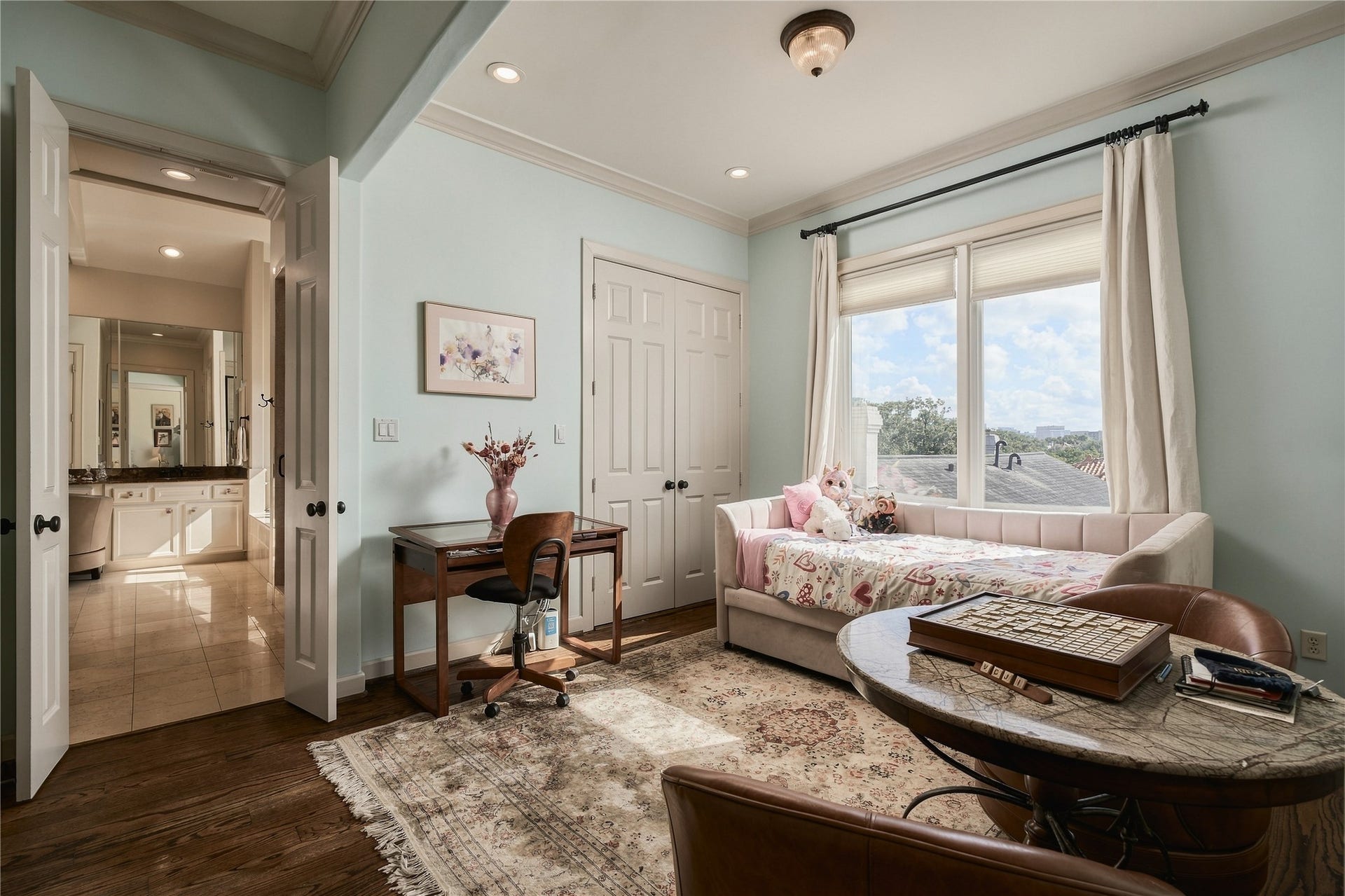 523 Lovett Boulevard, Houston, TX 77006 The primary suite extends beyond the bedroom itself, with a flexible adjoining space that now houses the homes relocated laundry while still offering room for an office, dressing area or quiet sitting space.