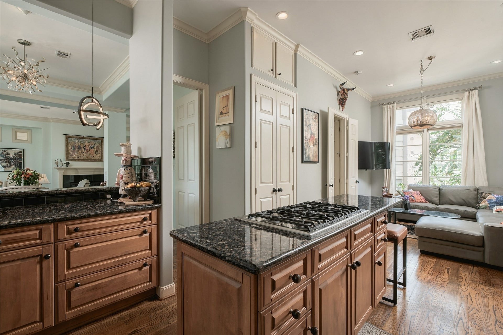 523 Lovett Boulevard, Houston, TX 77006 The kitchen opens into a more casual living space, creating an easy everyday counterpart to the more formal rooms at the front of the home.
