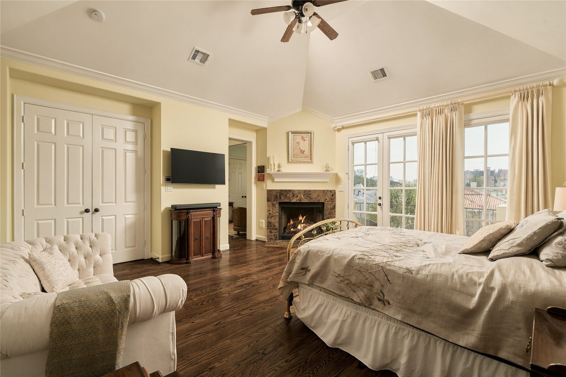 523 Lovett Boulevard, Houston, TX 77006 This is a bedroom designed for lingering, with morning light through the French doors, a fireplace for cozy evenings and enough room to create a true sitting area away from the rest of the home.