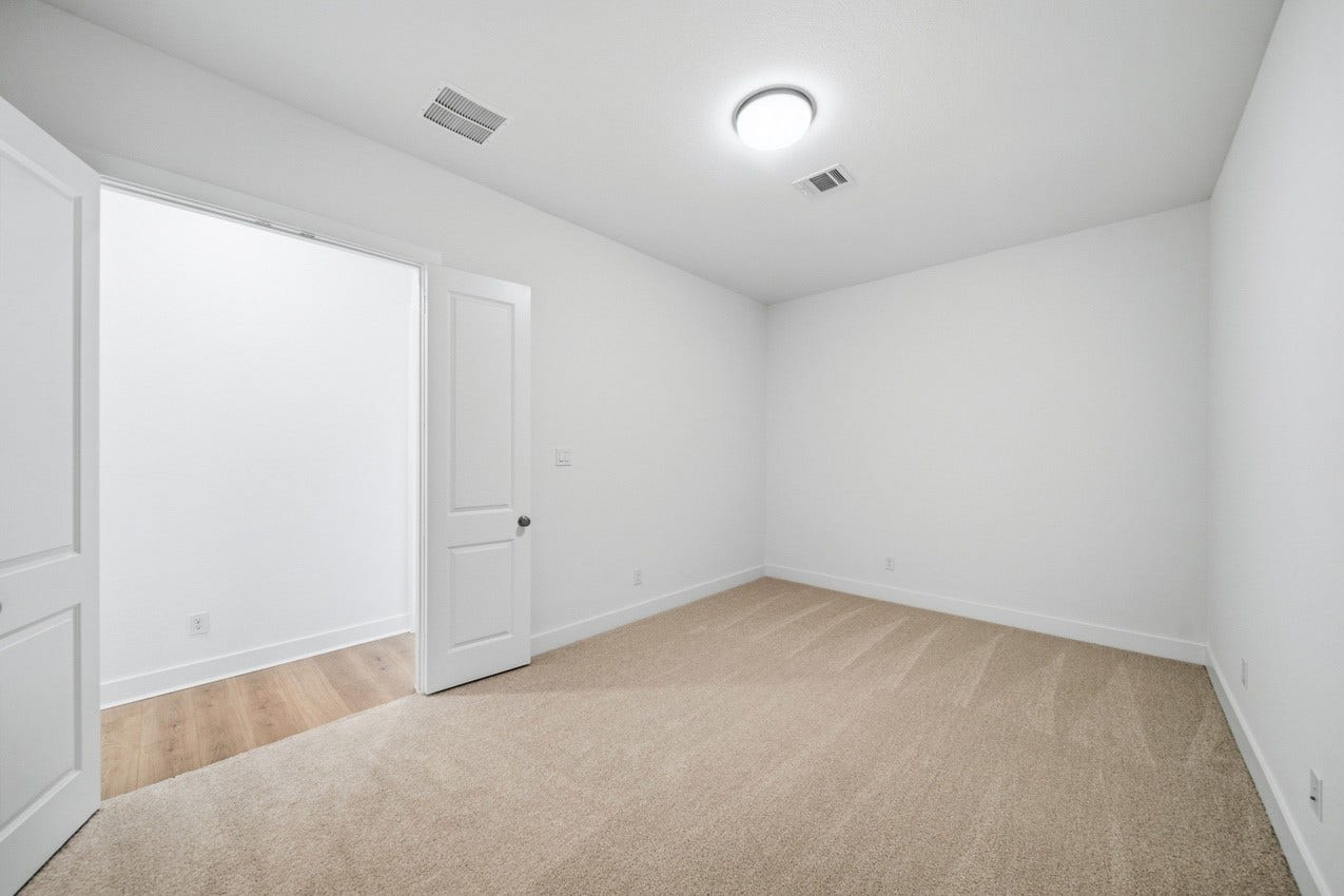 Flexible entertainment room ideal for a media room, home gym, playroom, or additional living space