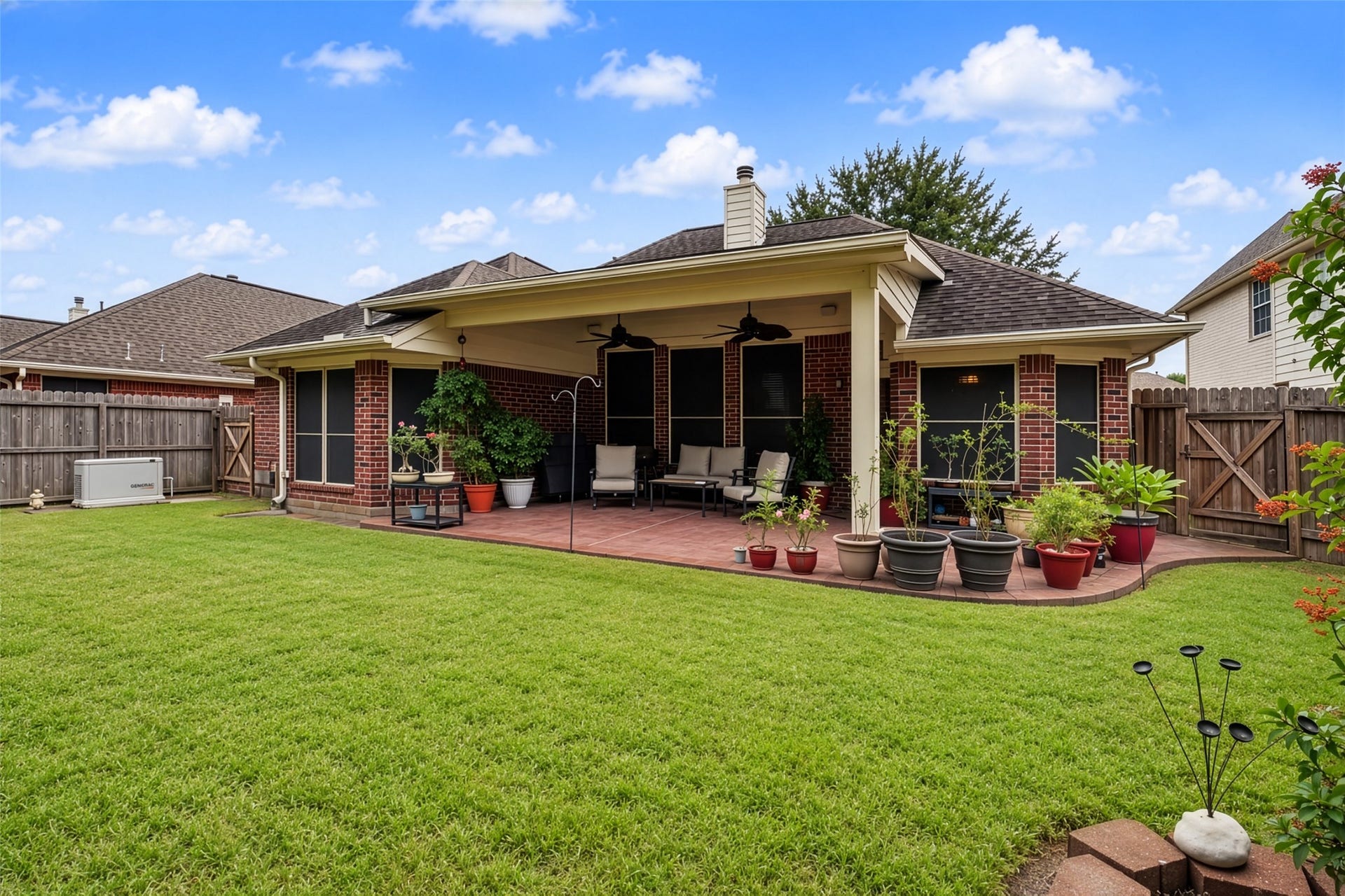 1918 Oakwood Court Drive, Baytown, TX 77521 Gorgeous yard with Generac Generator and extended patio