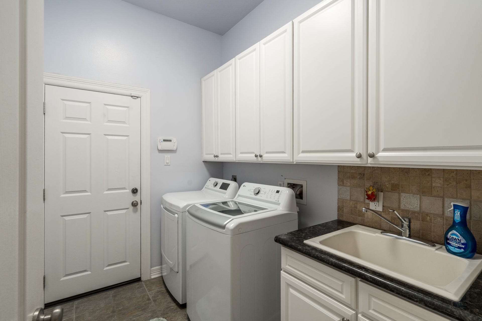 20303 Stone Lake Circle, Tomball, TX 77377 A downstairs laundry room that leads to the garage