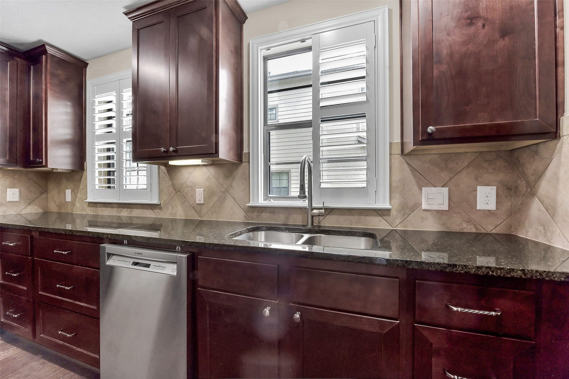 905 Garden Oaks Trace, Houston, TX 77018 Windows in the kitchen allow natural light to filter in and the shutters give you the ability to adjust the amount of light that you want to let in.