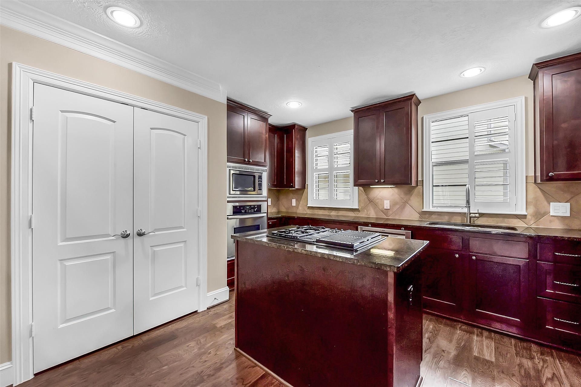 905 Garden Oaks Trace, Houston, TX 77018 Double doored pantry is within easy reach of the island.
