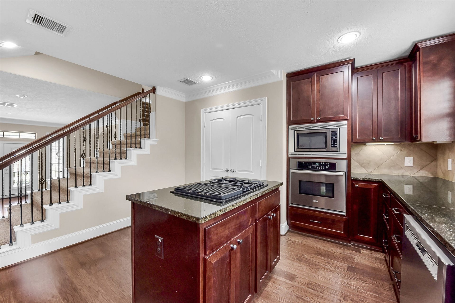 905 Garden Oaks Trace, Houston, TX 77018 Cabinets in the island contribute to extra storage space.